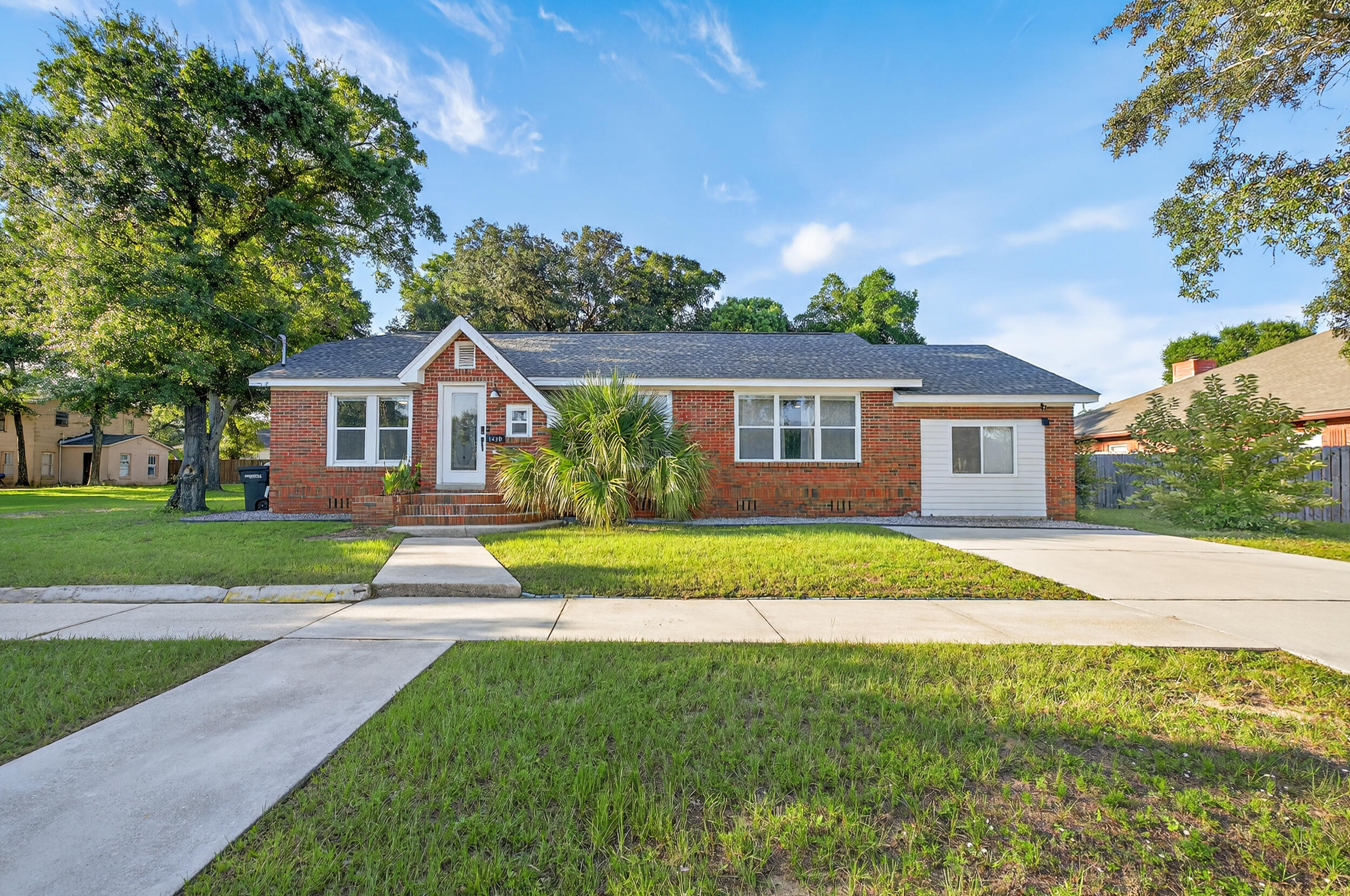 Charming and full of character, this 3 bedroom, 2 bathroom home is perfectly located in the heart of Pensacola & directly across the street from Legion Park giving you beautiful green space and recreation just steps from your front door! This home blends historic and vintage charm with thoughtful updates. Beautiful flooring, neutral tones, and natural light create a warm, inviting feel throughout. The updated kitchen is open to the dining area and features granite countertops, crisp white cabinetry, and stainless steel appliances, a perfect combination of style and functionality. A comfortable family room flows seamlessly into the living room, offering plenty of space for relaxing or entertaining. The split floor plan offers privacy for the spacious primary suite, complete with French doo rs leading to the backyard. The en suite bathroom feels like a retreat, boasting a large, tiled walk-in shower and modern finishes. Two additional bedrooms share a bathroom on the opposite side of the home for added privacy. Outside, you'll find a large, fully fenced backyard on a quarter-acre lot, the ideal setting for gatherings, pets, or gardening! A cozy fire pit adds a perfect touch for relaxing evenings or gatherings. This home offers the perfect blend of location, charm, and comfort. With its unbeatable proximity to Legion Park and central location to all the dining, shopping, and entertainment Pensacola has to offer, this one is a must see!