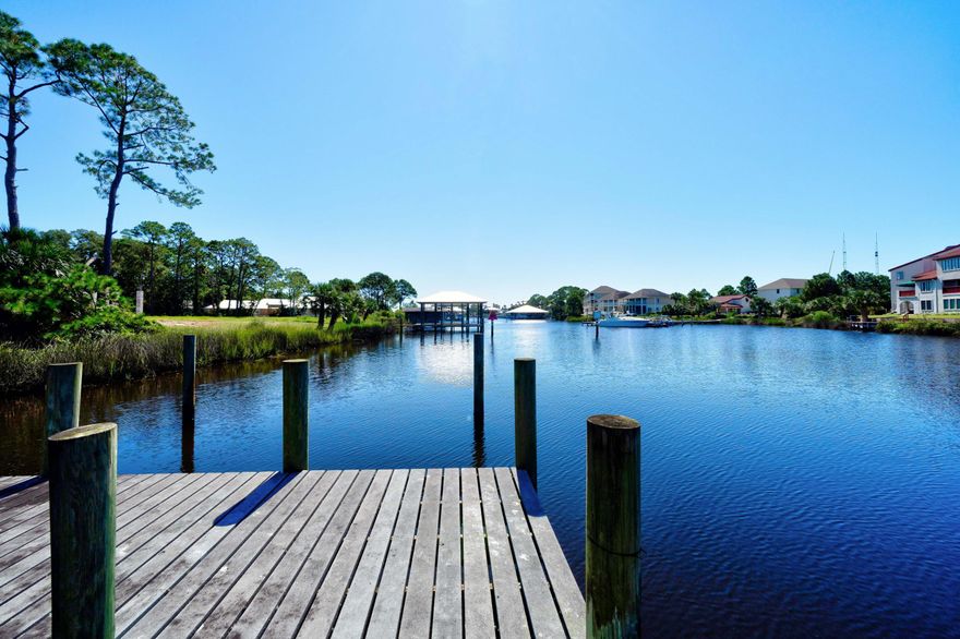 100 waterfront feet on North Lagoon in Panama City Beach! One story home on lagoon featuring 4 bedrooms, 3 full baths, gorgeous kitchen, large laundry room, office, Florida room; complete with pool, 1/2 acre yard, and dock. This well cared for home is solid with stucco over concrete block, and boasts hardwood floors, granite countertops, waterfront master that steps out to a private deck, and spacious living room with gas fireplace. Enjoy watching nature in your backyard resort with pool, patio area, green space and dock - all with lagoon views! Backyard is fenced in, has a convenient side double gate entry, and shed with power. 2 car garage and ample driveway parking. Private office with it's own entrance which is great for a home business. NO HOA! Call today for your new waterfront home!