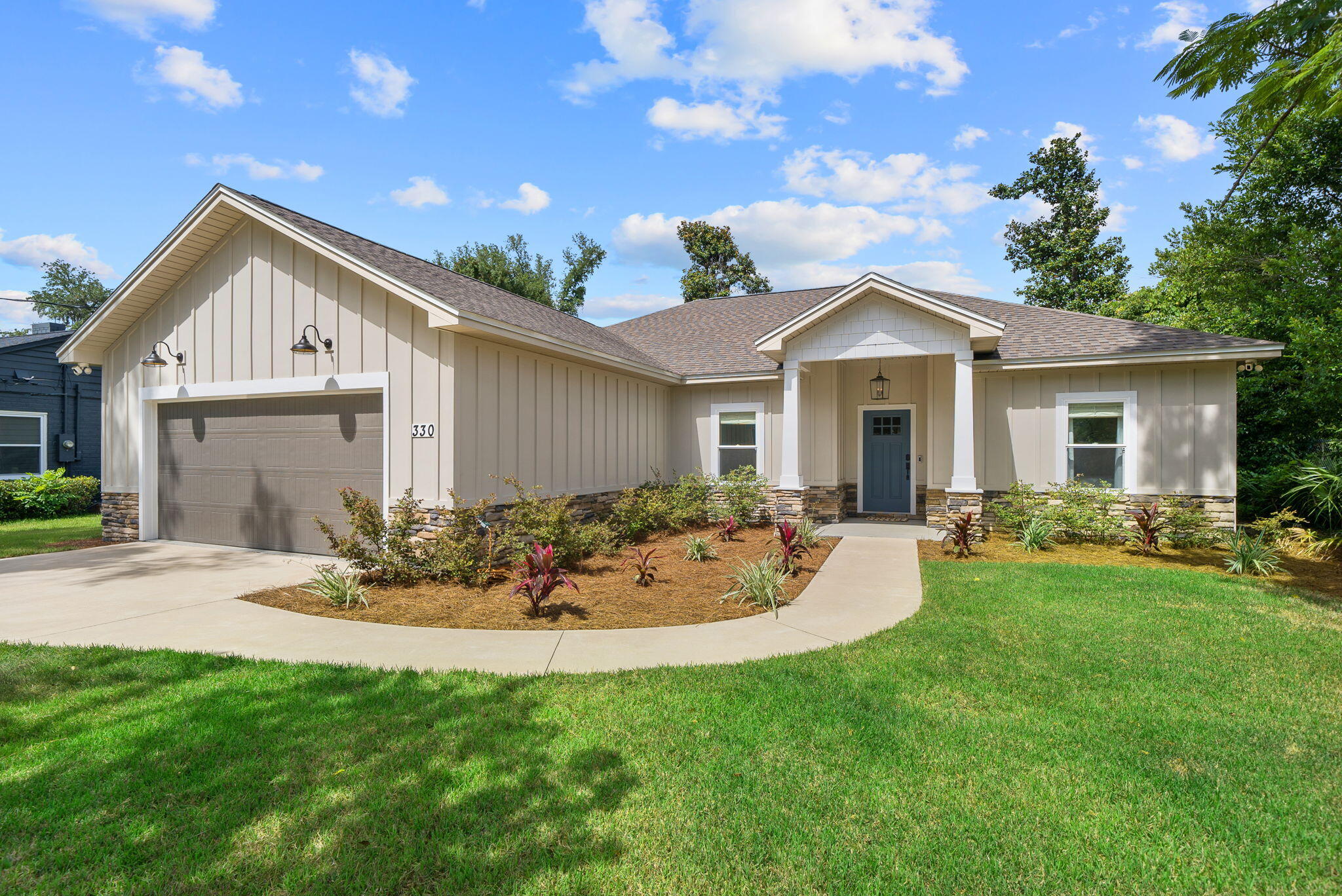 It's rare to find a newer construction home in the coveted Cove neighborhood of Panama City, Florida and this stunning home was built in 2022 and offers a single-level residence that embodies classic, coastal design and offers an exceptional lifestyle just two blocks from the Bay. Enjoy leisurely walks by the water and breathtaking sunsets every day in the Cove, a golf cart-friendly community with NO HOA where neighbors gather and community thrives!This impeccably maintained home spans 1,948 square feet and features a timeless design with 4 bedrooms, 2 baths and a 2-car garage. The property sits on a .25-acre homesite, complete with a privacy-fenced backyard and alley access with a gate. This home has plenty of room for a POOL so you can create your dream backyard oasis to enjoy year round! With no HOA restrictions, it is ideal for boat and trailer owners!
The lush landscaping enhances the curb appeal of this remarkable residence clad in Hardie board and stone. You'll love that the major systems of the home are 2022 to ensure lower interest rates and peace of mind with little to no maintenance.
Step inside to discover a true foyer area as you walk into an open concept layout flooded with natural light. The home offers 10' ceilings in the great room with an 11' tray ceiling in the living area. The remainder of the house has high 9' ceilings throughout giving it an incredible open feel. With French doors leading to the patio, you'll love the indoor outdoor experience this home provides. A covered porch overlooks the backyard, ideal for grilling, watching the kids play, and hosting family gatherings. The home has incredible upgrades, including custom built-ins in the living area, Visual Comfort designer lighting, custom window coverings throughout and Quartz countertops. The oversized kitchen island offers seating for five, making it a perfect gathering spot. With stainless appliances and a full size pantry, this kitchen is great for entertaining. The dining room is bright with natural light and overlooks the backyard.
The split floor plan ensures privacy, with a large primary suite featuring a 10' tray ceiling, dual bath vanities, a soaking tub, tiled shower with glass enclosure, separate water closet and a large walk-in closet designed for two. Two guest bedrooms are located on the right side of the house, with a guest bath accessible via the hallway. The fourth bedroom, situated just off the living area, offers versatile use as a bedroom, home office or playroom, with ample storage provided by two closets.
Experience the perfect blend of coastal charm and modern convenience of a newer home in the Cove that was built in 2022. Every detail has been thoughtfully considered to create a welcoming and comfortable feel with this exceptional home in a highly desirable neighborhood! With hundred year oak tree-lined streets, new sidewalks throughout and charming community parks and playgrounds, there's a reason people love to call the Cove home.
The Cove is conveniently located adjacent to Downtown Panama City where you'll enjoy restaurants, shopping, weekend farmers markets, community festivals and more! This booming area is fast-growing and the proximity to the Cove is remarkable for that fun lifestyle that is desired by so many.