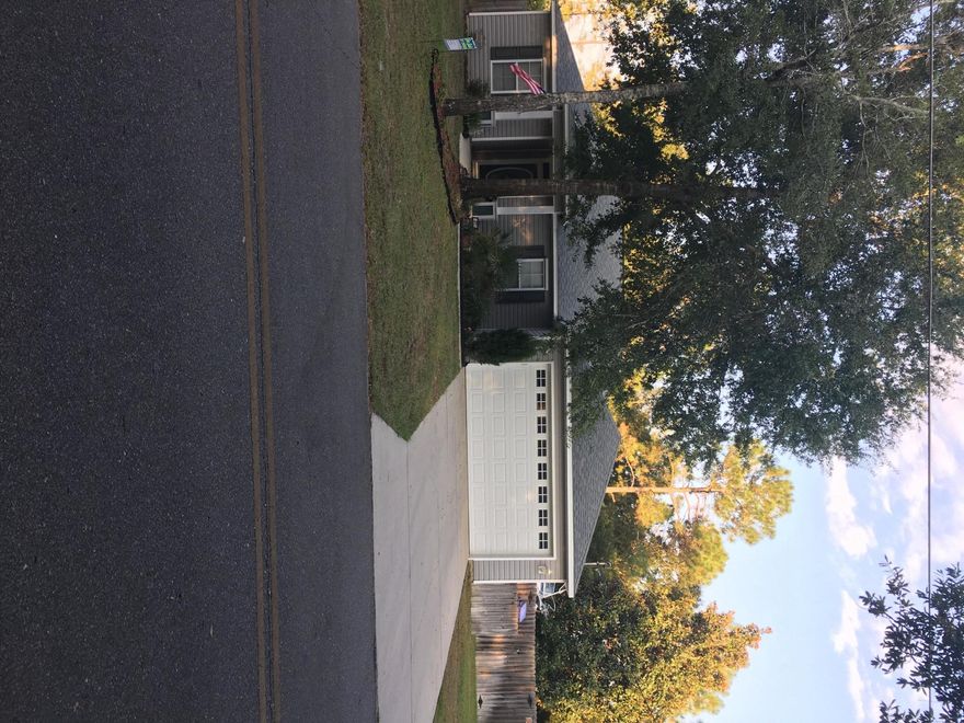 4 bedroom 2 bath open, split floorplan home. Large living room has cathedral ceiling. You can sit in your large screened back porch and watch the birds in your privacy fenced yard. (back property goes past the fence). Yard does have an irrigation system. Small storage shed in back yard. Kitchen has upgraded cabinets and granite counter tops. Master bath has a walk-in closet, double vanity, large garden tub, separate shower and water closet. 4th bedroom is currently being used as an office. Home also comes with Hurricane Shutters. Please verify all matters of importance. More photos coming soon.