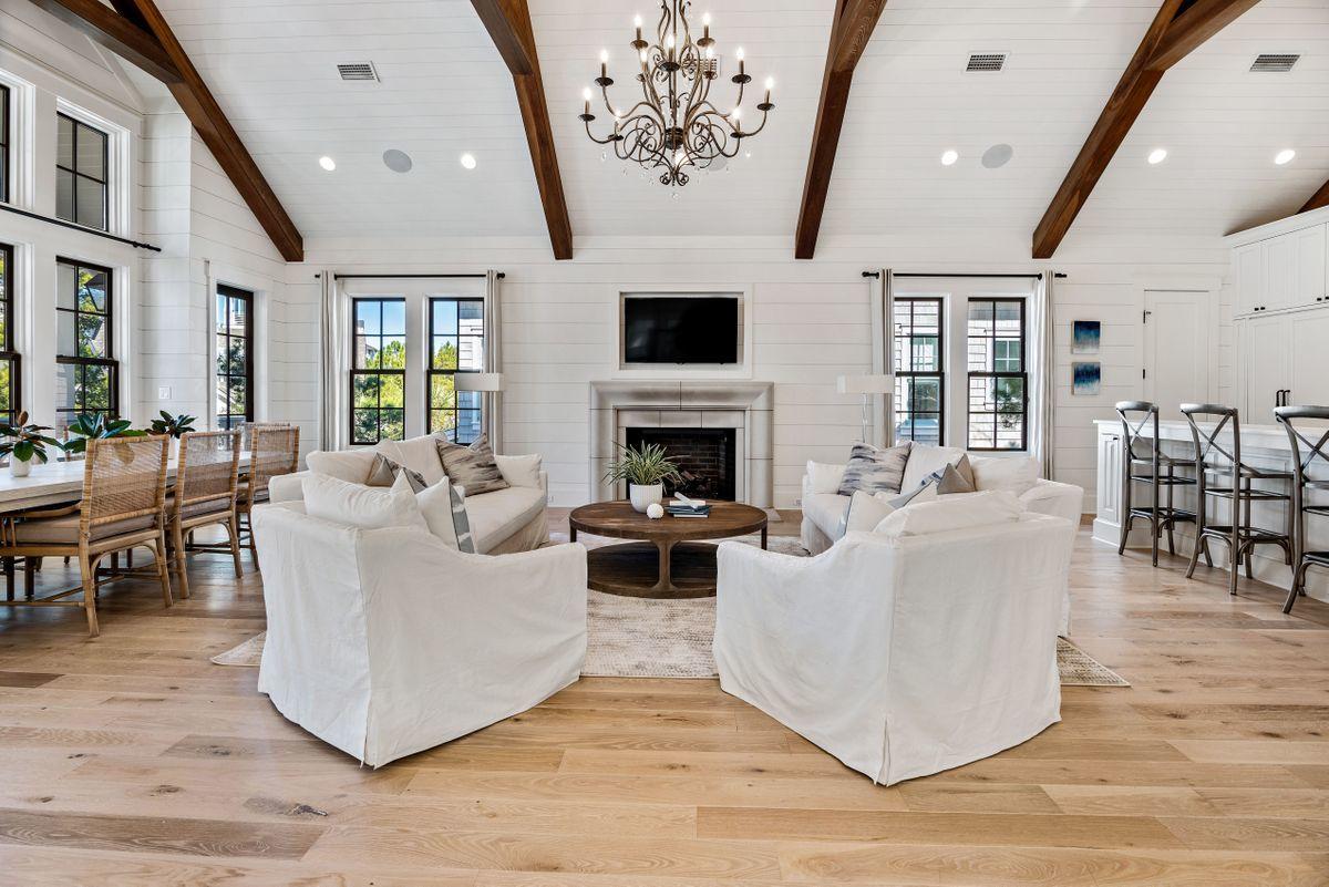 This beautifully detailed Nantucket-style masterpiece is located in the highly desired gated neighborhood of WaterSound Beach along Scenic Highway 30A. This magnificent home offers impeccable design and quality throughout. Step inside to a bright open floor plan, professionally decorated by Dwell Interiors, featuring oak flooring, a gracious living area with vaulted ceiling, gas fireplace, and state of the art gourmet kitchen with marble countertops, and professional stainless steel appliances. Relax in the stunning master retreat with ensuite bath that includes marble countertops and flooring as well as a large walk-in shower and separate soaking tub. Outside, enjoy the private heated pool with a water feature as well as a covered porch, the perfect spot to relax.