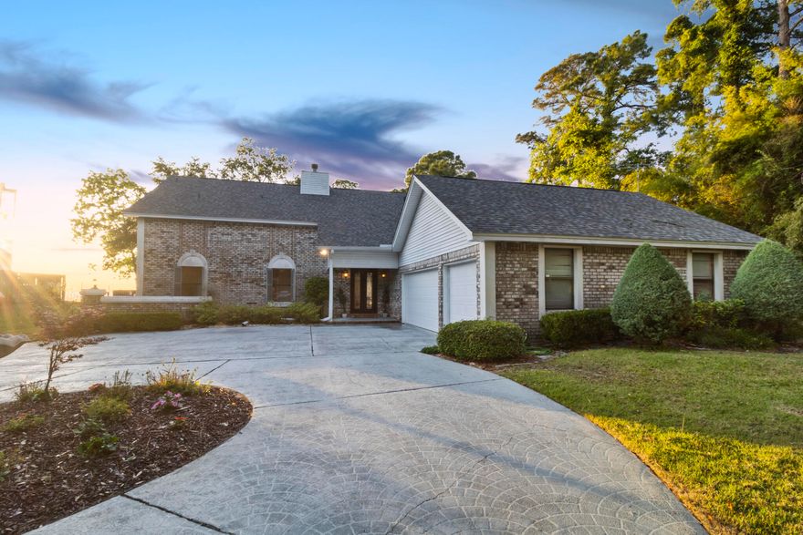 WATERFRONT home situated on nearly 3/4 acre on East Bay in Navarre. Experience waterfront living with stunning bay views from every bedroom in this exceptional home. Each bedroom boasts its own ensuite bathroom, offering privacy and convenience. Additionally, the two upstairs bedrooms feature private balconies overlooking the water. Entertain with ease in this thoughtfully designed home featuring an expansive living room that serves as the ideal gathering space which also offers views of the bay. Choose from multiple dining settings, including a convenient breakfast bar, a charming breakfast nook bathed in natural light, and a formal dining area for special occasions with a view of the bay. Step outside to the covered lanai, where you can extend your entertaining space outdoors and