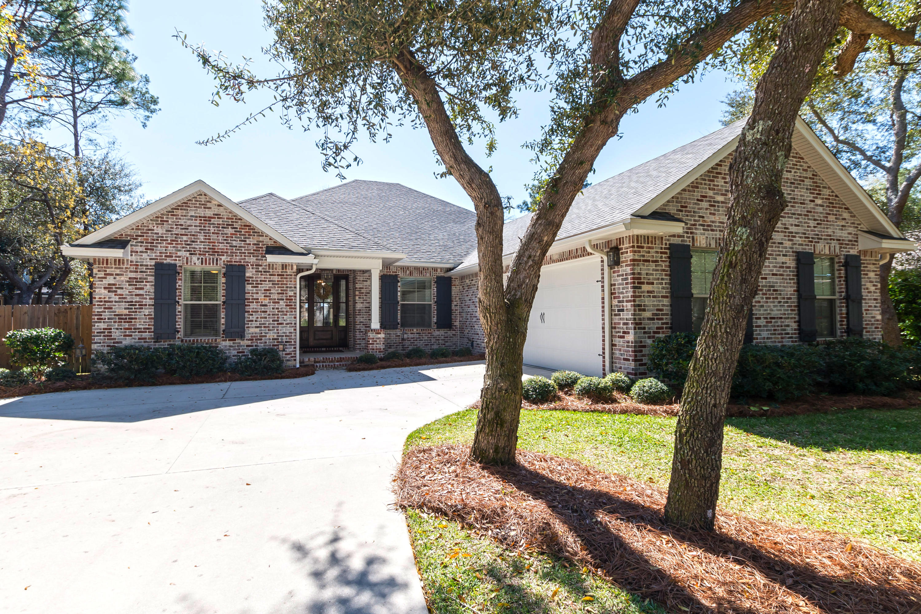 This home built in 2014 is an absolute Must See! The mahogany front door leaves a great first impression. Inside is an entertainer's dream with an open floor plan and beautiful kitchen. The master suite, with a large walk-in shower has a double sided entry, it is truly a statement piece. Some of the home's special details include: high ceilings, a marble back splash in the kitchen, a farm sink, soft close drawers, upgraded lighting, leather textured granite, engineered hardwoods, wood blinds, marble counter tops in the guest baths, spray foam insulation, and so much more. No small details were left unattended. The home is full of interior and exterior storage (exterior storage is located through double doors on the side of the house). Don't miss the opportunity to see this home today!