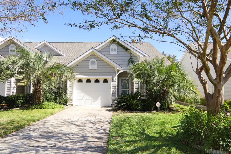 New carpets at full price! Make your dream a reality! This lakefront townhome is not to be overlooked. The moment you step into this home, you will be in awe of the soaring vaulted ceiling and open floor plan. The master bedroom and ensuite are conveniently located on the first floor. The rest of the bedrooms are upstairs. Townhome backs up to a beautiful common area that has a walkway around the lake, perfect for enjoying a scenic stroll and jogging! The lake also features a fountain and gazebo/pavilion. Tiger Point Park is within walking distance of this home and includes: athletic parks, tennis courts, basketball courts, 1-mile walking track, and two playgrounds! Both shopping and restaurants are a quick drive away too!