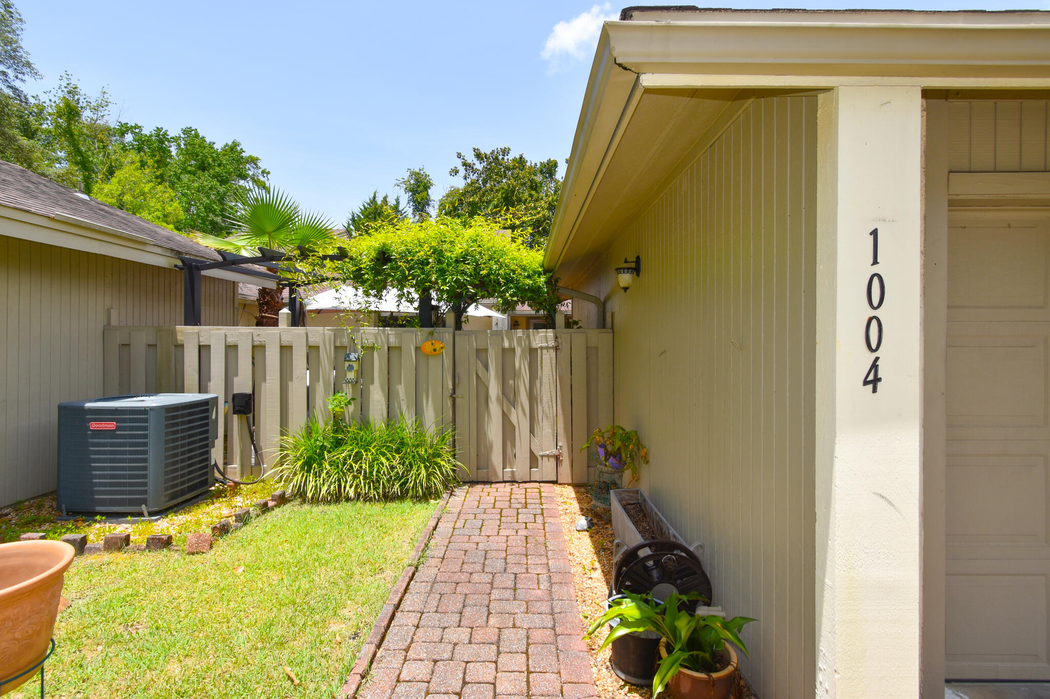 CORNER-LOT GARDEN OASIS! Located in Royal Oak Village of Bluewater Bay, this 2 bed, 2 bath home features an open layout, vaulted ceilings, wood floors, plantation shutters, and sunroom (ideal office or 3rd bed). Gourmet kitchen offers pro appliances and gas stove. Primary suite has a chic bath, walk-in closet, and private patio. Guest room also has walk-in closet. Enjoy a private courtyard, custom screens, double garage, and low HOA dues covering exterior care. Resort amenities: golf, tennis, pickleball, pools, trails, marina, and dining. Near Eglin AFB, schools, and Destin beaches--live the coastal lifestyle!