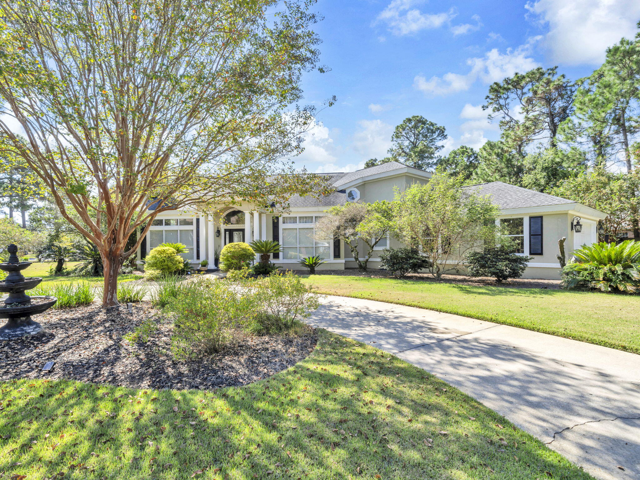 Renovated 4-bedroom 3 bath home in the gated community of Southwind in BWB. The remodeled kitchen has granite counter tops, wood cabinets, stainless steel appliances, walk-in pantry, & island with storage. The family room is right off the kitchen for open concept living. The living room has high ceilings, a fireplace, curved staircase with wrought iron to the second floor and is open to the large dining room. There is custom trim work throughout the home. In addition, this fabulous home has a screened in porch with outdoor kitchen area, and a heated and cooled Florida room on the first level. 3 bedrooms up including spacious primary and 2 renovated baths up, 2 car attached garage, circular drive, laundry room with sink. Large yard with firepit, pergola and beautiful plantings.