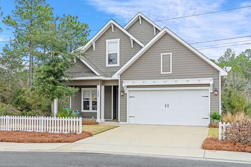 Located on one of the best lots in Paradise Cove; this is a beautiful home with a spacious open concept.  The living & kitchen areas are centered around a tiled fireplace.  This kitchen includes granite countertops, soft-close white cabinets, stainless appliances, and a large breakfast bar, and a dining room  perfect for entertaining guests. The home features a master suite on the first level with an ensuite. There are double vanities, a soaking tub and a walk-in shower,  plus a large custom master closet. Upstairs there are two comfortable guest rooms w/baths. Relax on your front porch close to the pool, or pick the screened back porch as the perfect spot to lounge with privacy.  This is   Boswell model home with loads of upgraded finishes. Second floor has large storage area, which can