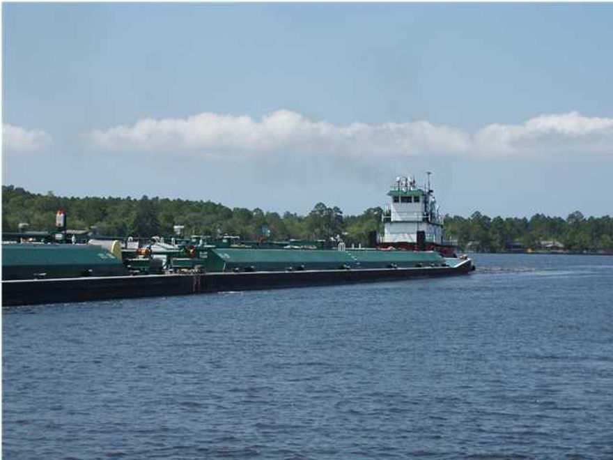 1.011 Wooded Acre, 66 Ft of Waterfront, Lot dimensions 66 x 695.83 x 71.25 x 724 Ft, on beautiful LaGrange Bayou in Freeport, close to Freeport Regional Sports Complex and Hammock Bay and the Public Marina at Marina Village. Public water and sewer available. Watch the barges travel the inter coastal and look for dolphins,osprey and eagles on your little bit of Paradise.