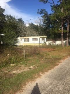 Property begin on the corner of Davis and Andrews and goes to next street. There are 6 mobile home lots and a house. They all need work. There are 7 water meters and units are on city sewer. Property is sold ''as is''.