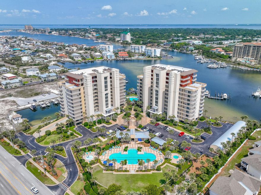 Step into the perfect blend of laid-back beach days and sun-soaked harbor adventures at Harbor Landing on Holiday Isle. This stunning condo makes every day feel like a seaside getaway--enjoy deeded beach access for morning strolls, then spend your afternoons exploring Destin's vibrant canals.Watch the boats glide by and catch nightly fireworks from your covered balcony--offering panoramic views across Destin's sparkling harbor waters, the emerald Gulf, and lively Harborwalk Village. Inside, two spacious bedrooms with private baths create a relaxing coastal escape for you and your guests. The open-concept living area seamlessly blends dining and entertaining, spilling onto your balcony for true indoor-outdoor living.Brand new AC (2024) keeps things cool after beach days, and you'll love the resort amenities: two sparkling pools (one owners-only for extra privacy), two hot tubs, and a grilling area with picnic tables perfect for after-boating barbecues.

Whether you crave long beach days or want direct access to the canals for boating, kayaking, and paddleboarding, Harbor Landing gives you bothyour private piece of paradise where every day is a beach and boat day!