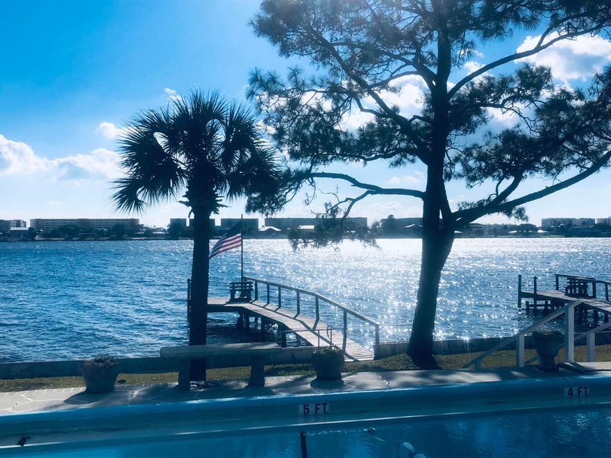 This townhome is located in a small waterfront complex within walking distance to the Fort Walton Beach Downtown District with many shopping, dining , and pub options. A beautiful soundfront pool as well as reserved parking right outside your front door. A boat dock for fishing and temporary mooring available The perfect spot to enjoy all of the Fireworks displays over Santa Rosa Sound. Very convenient location. Pool and water views!