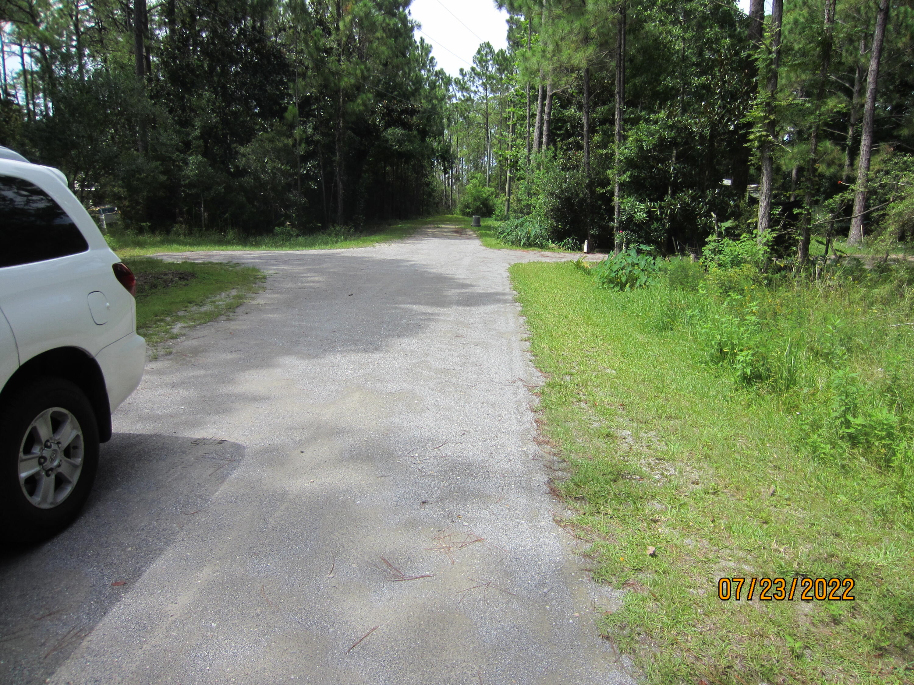 Vacant lot ready for your mobile home, tiny house, or build that home. NO HOA. No fees to that homeowner's association. Enjoy this convenient location with easy access to Hwy 98 and Scenic 30A Beaches, Shops, and Restaurants. Drive to Destin in minutes. You will love the peace & tranquility. Come see it now and buy this piece of Paradise.