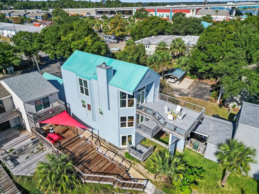 Please read agent notes prior to showing. Beautiful bay view off Bayou Chico. Entry level welcomes a master suite or guest quarters with a private patio and water view and a second bedroom or flex room. The options are limitless. Use it as a game room, office, den or play room. Second floor has a common bathroom and upgraded vanity and exotic stone quartzite countertops as well as the laundry area. A very large and spacious master bedroom with ensuite. Master bedroom has wood floors and Cat 5 rated high impact hurricane windows and sliding doors. From the second floor master suite you are able to step out to a private deck and enjoy all the marine views of the Bayou Chico. The third floor boasts a completely updated open floor plan kitchen with island, quarzite countertops, backsplash.