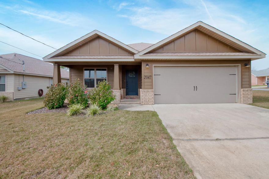 Custom built home in coveted East Navarre. This luxurious 3 bed/2 bath floor plan is perfect for a family, retiree, or investor. Great central location within walking distance to the Waterfront Navarre Park and minutes to Navarre Beach. Easy access to shopping, Hwy 98 and Hurlburt Field. This Stunning Robbins Builders Custom Home offers trend setting features. You are greeted by a walk-in foyer sweeping through to your open floor plan. A large kitchen enjoying custom staggered cabinets with crown molding and beautiful granite counter tops w/an under-mount sink. All stainless-steel appliances, large walk in pantry and utility room. The wrap-around, hop up center island with pendant lights opens up to the family room. Wood-look tile throughout the foyer, main living area, laundry & bathrooms