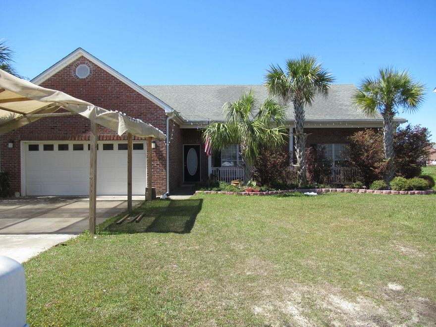 Yea!!!! No HOA's. AC new in 2018 inside and outside units. Owner will pay the sewer tap fee at closing.This 3 bedroom 2 bath home features a vaulted ceiling and an electric fireplace, nice front porch and backyard patio plus a 2 car garage. Separate dining plus breakfast nook. Oak cabinets and grant countertops.