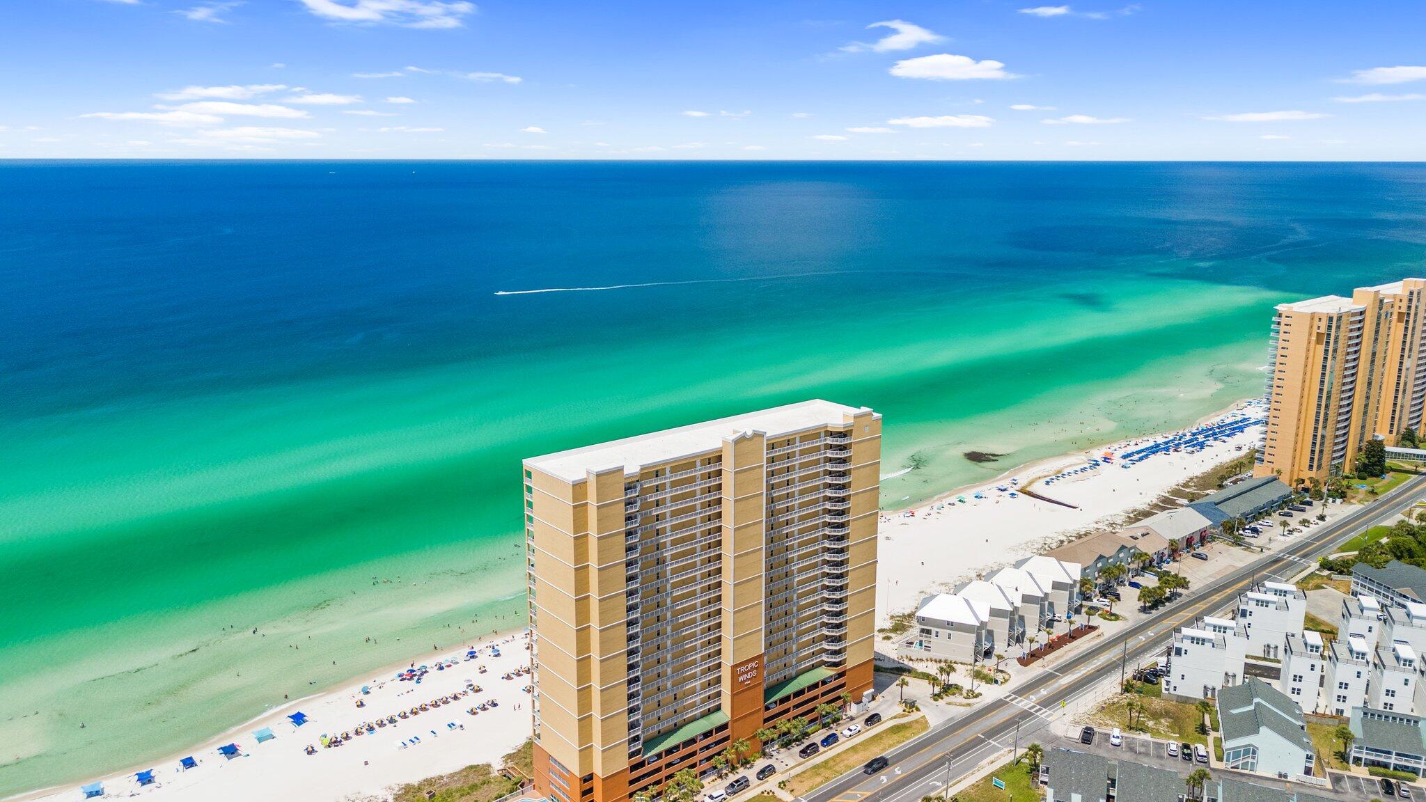 BEST PRICED CONDO AT TROPIC WINDS - AND the most fabulous! PRISTINE CONDITION: Never been a rental PARKING SOLVED: Comes with TWO deeded garage spots! ELECTRONIC ROOM DARKENING SHADES in living room and Gulf-front Master This gorgeous 2/2 condo has been this family's memory-maker for the past ten years, and now it can be YOURS! Beachy decor and ALL the best details: * Stacked stone detailing in entry and island
* Exquisite granite countertops
* LG fridge
* KitchenAid dishwasher
* Frigidaire electric range and microwave
* Disposal
* Dining seating for 6 at the table plus 3 at the bar
* Laundry room with Samsung W/D
* Nest thermostat to control from your app
* Wood-look tile in both bedrooms
* King bedroom
* Queen bedroom with Twin/Twin bunks
* HUGE balcony (9.5' x 27.8')
AND HAVE YOU SEEN THE AMENITIES?
BBQ Pit/Grill " Fitness Center " Meeting Room " Picnic Area " Pool " Sauna/Steam Room " Spa/Hot Tub
AND...TWO DEEDED PARKING SPOTS!
What's not to love? Come see this TODAY!
NOT a rental. Vacant and EASY TO SHOW!
We look forward to receiving your offer!
