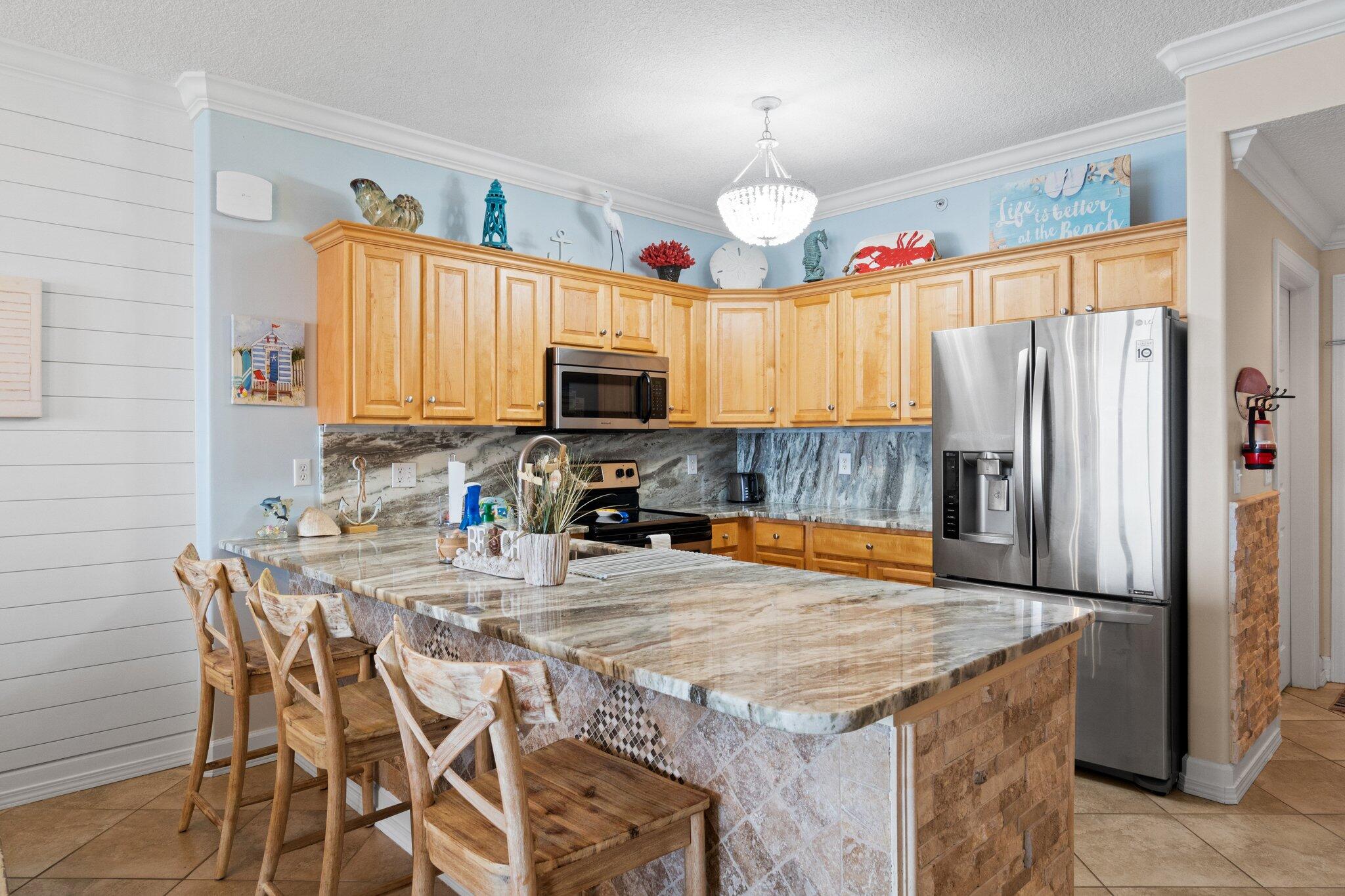 BEST PRICED CONDO AT TROPIC WINDS - AND the most fabulous! PRISTINE CONDITION: Never been a rental PARKING SOLVED: Comes with TWO deeded garage spots! ELECTRONIC ROOM DARKENING SHADES in living room and Gulf-front Master This gorgeous 2/2 condo has been this family's memory-maker for the past ten years, and now it can be YOURS! Beachy decor and ALL the best details: * Stacked stone detailing in entry and island
* Exquisite granite countertops
* LG fridge
* KitchenAid dishwasher
* Frigidaire electric range and microwave
* Disposal
* Dining seating for 6 at the table plus 3 at the bar
* Laundry room with Samsung W/D
* Nest thermostat to control from your app
* Wood-look tile in both bedrooms
* King bedroom
* Queen bedroom with Twin/Twin bunks
* HUGE balcony (9.5' x 27.8')
AND HAVE YOU SEEN THE AMENITIES?
BBQ Pit/Grill " Fitness Center " Meeting Room " Picnic Area " Pool " Sauna/Steam Room " Spa/Hot Tub
AND...TWO DEEDED PARKING SPOTS!
What's not to love? Come see this TODAY!
NOT a rental. Vacant and EASY TO SHOW!
We look forward to receiving your offer!