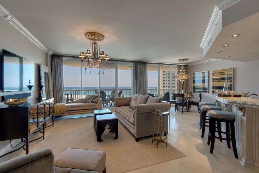 This is an exquisite, MUST SEE, totally renovated 3 bedroom, 2 bathroom Gulf Front Condo. From the 18'' Italian Alabastrino Travertine floors throughout to the Gold plated Persian Onyx fixtures in the bathrooms, no detail has been left untouched. The kitchen features Thomasville Hardwood cabinets, gorgeous granite and stainless steel appliances. Throughout the condo you will find Tuscan Columns made of Columbian Travertine. The bathrooms have lovely Borneo Black Italian granite counter tops with white onyx sinks and Black and white Italian marble tile in the showers. There are dazzling chandeliers in every bedroom and in the dining room and crown molding throughout. The hallway features a distinctive marble star design in the