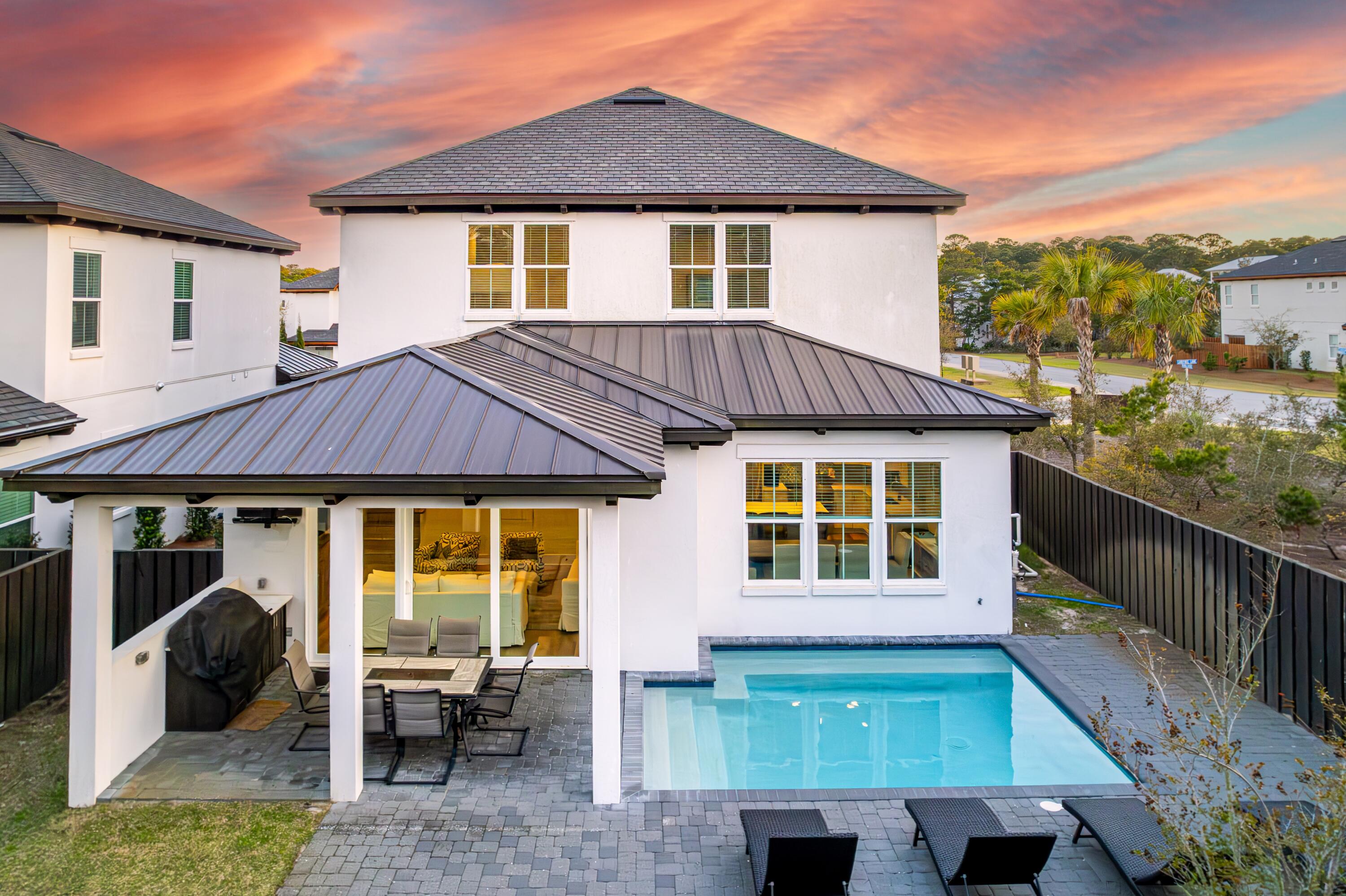 Discover your dream beach house in the tranquil Santa Rosa Retreat, just steps from 30A. This home offers everything needed for a luxurious coastal lifestyle, including four bedrooms--two of which are primary suites plus a bunk room. Enjoy the convenience of a private heated pool and a garage equipped with a newer 6-seater golf cart, accommodating up to 12 guests. Offered turnkey, 'Happy Days' is adorned with high-end coastal furnishings for a seamless move-in experience.The first floor features a spacious primary bedroom with a large walk-in closet, a soaking tub, and a shower. The chef's kitchen is a culinary delight, boasting an upgraded 6-burner gas stove and a large island with seating, perfect for entertaining. The living area flows effortlessly into the private pool area, accessible through the dining room, creating an ideal setting for indoor-outdoor living. Step through the expansive sliding doors onto a covered patio, complete with a grilling area and space for an outdoor TV, perfect for relaxing or entertaining.
The upper level features another primary suite with an en-suite bathroom, offering serene views of the pine trees. On the south side, two additional bedrooms share a thoughtfully designed Jack and Jill bathroom with dual vanities. A versatile bonus/bunk room provides an extra space for relaxation, complete with a bunk bed, TV, and PlayStation, making it perfect for kids, teens, or adults to unwind after a day at the beach.
Situated on a corner lot in the exclusive Santa Rosa Retreat, this home offers unparalleled privacy with no neighbors to the west. Enjoy the tranquil setting of this small community, surrounded by lush greenery, and just a short walk from the beach and the vibrant shops and eateries of Gulf Place, Shunk Gulley, and Papa Surf.
Included with the property is a six-seater golf cart, ensuring easy access to Ed Walline Beach Access, Spooky Lane, and Dune Allen Beach Access.
Designed with a beach vacation in mind, each bedroom is furnished with a king-sized bed. The bunk room's entertainment setup guarantees fun for all ages. Recent visitors have praised "Happy Days" as a "beach lover's dream," and this immaculate home is ready for its new owners to create lasting seaside memories.