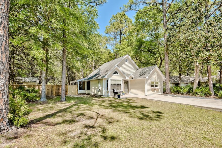 Looking for a sweet beach cottage in Santa Rosa Beach? This cozy paradise is located just off 393, between the gulf and bay in the gated community. Perfect for a second home or full-time residence. This home is made for entertaining with its vaulted ceiling and open floor plan! The cottage also features bamboo pre-engineered hardwood flooring throughout and the kitchen is ready for guests with its upgraded granite counter tops and back-splash. You will love the serenity of oversized screened porch overlooking the privately fenced backyard backing up to mature oak trees on the 0.25 acre lot.  Get more peace of mind knowing the roof was replaced in 2016 and the water heater in 2020.  Don't miss your chance to enjoy living the laidback, local, lifestyle. No short-term rentals, it won't last.