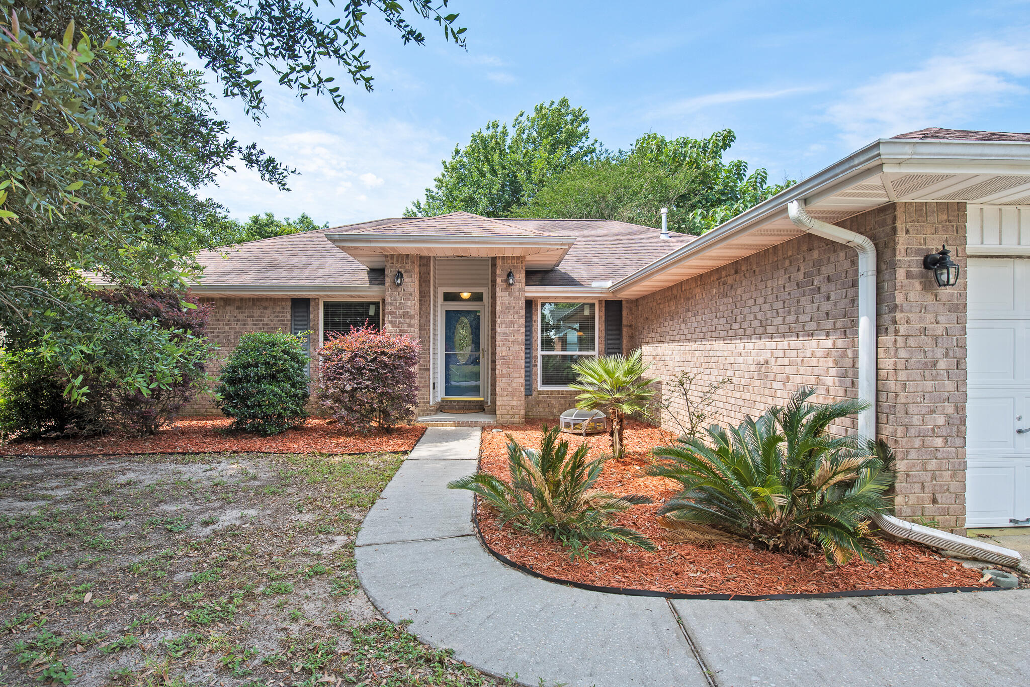 This brick home features 3 bedrooms and 2 bathrooms along with 2 additional bonus spaces:  1 formal dining room and 1 office.   Either can easily be converted to a 4th bedroom.  As you walk in, you'll appreciate the vaulted ceiling and larger living room area.  The kitchen has gorgeous granite countertops, stainless steel appliances and updated backsplash.The backyard is huge and complete with an oversized screened in back porch where you can entertain family/friends or enjoy dinner out back!  The home comes with hurricane shutters as well.