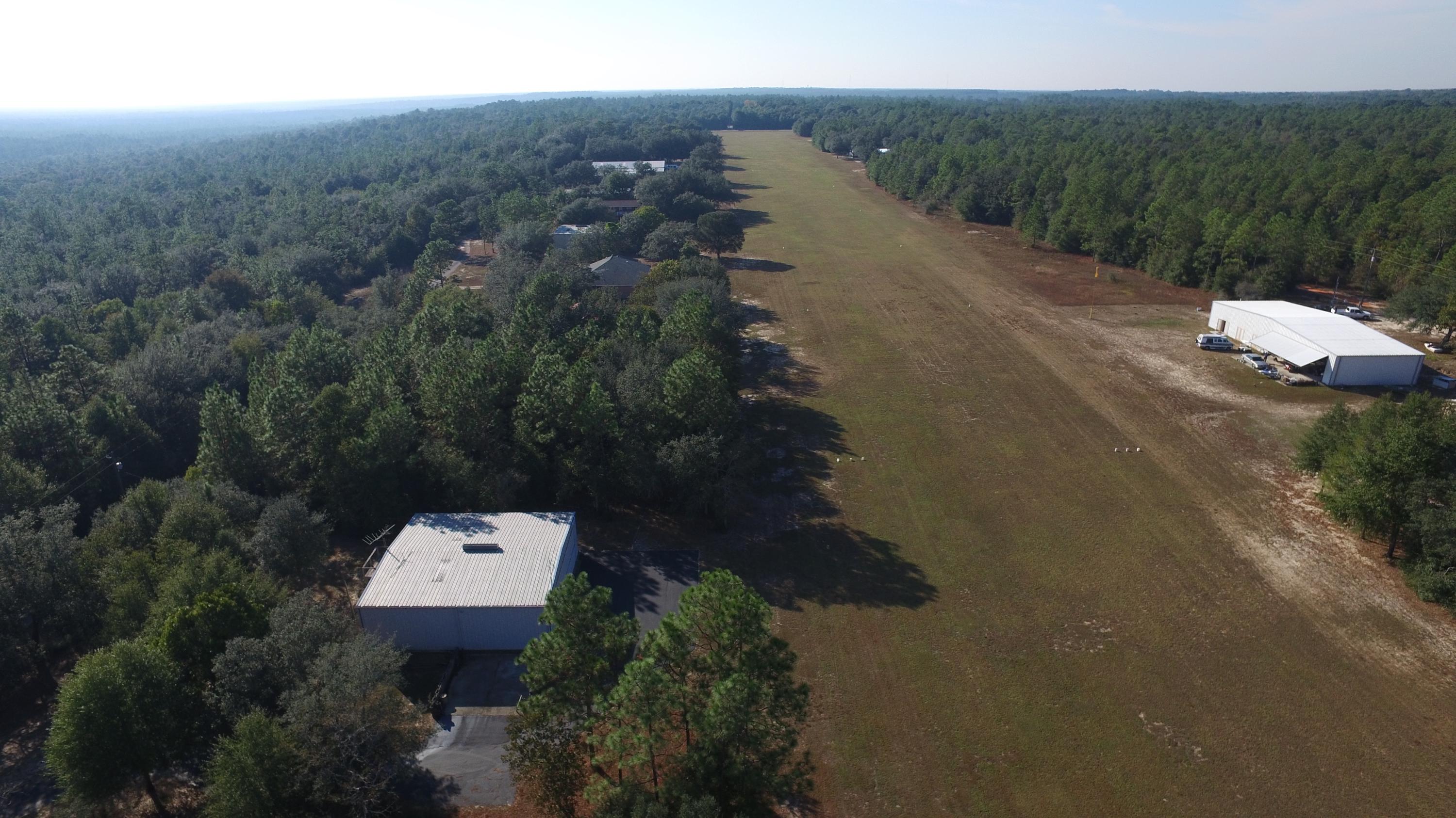 Paved Sky Ln and the Yellow River grass Field Airport! $180 per year HOA fees on an Airport ! Bring your Hanger Home here today! See existing hanger next door! Just bring the home! Grass Air Field! A slice of heaven under the sunset on the Yellow River Airport. This is an FAA private air field approximately 100 ft wide and 255 feet long.There is a 50 ft taxi way on each side of the run way. Bring you hanger /house plans and fly by for a visit! The location is just South of I-10 Located by the Destin Beaches, Military Bases, Crestview, Holt, Pensacola and Destin! Beautiful Oak trees, level homesite and Beautiful Sun Sets!FAA Identifier: FD93Lat/Long: 30-41-07.6870N / 086-44-49.8420W30-41.128117N / 086-44.830700W30.6854686 / -86.7471783(estimated)Call For Fly in Instructions today!