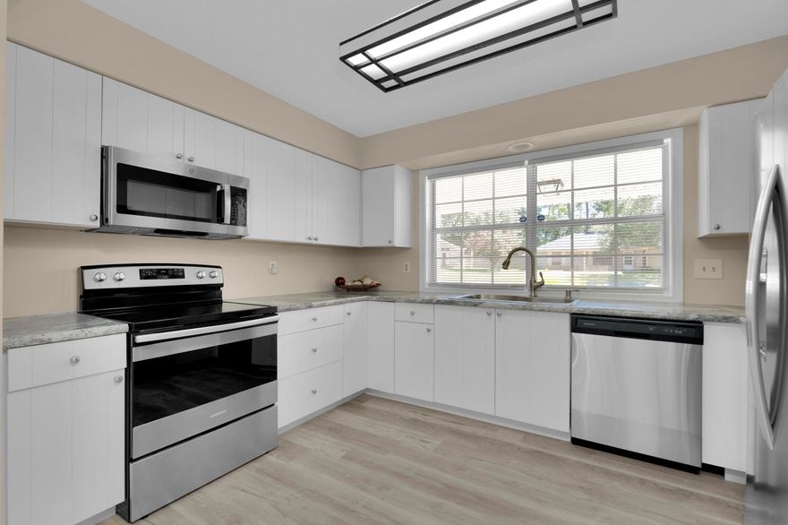 You will love this enchanting two-story colonial located in the desirable Old Hickory subdivision offering the perfect combination of peace, privacy, and charm. You will enjoy the serene subtle nature as the back of the property is bordered with tall pines and backs up to a greenbelt. Inside, you will embrace the inviting, cozy cottage ambiance with its tall cathedral ceiling and quaint fireplace. You will feel at ease, as this home has undergone many upgrades including new laminate flooring throughout the downstairs, new kitchen cabinets and countertops, and new fencing. The lower level is open and airy, perfect for entertaining, and is comprised of an open concept layout with an abundance of windows for natural light. The sizeable kitchen features an eat-in dining area, new white