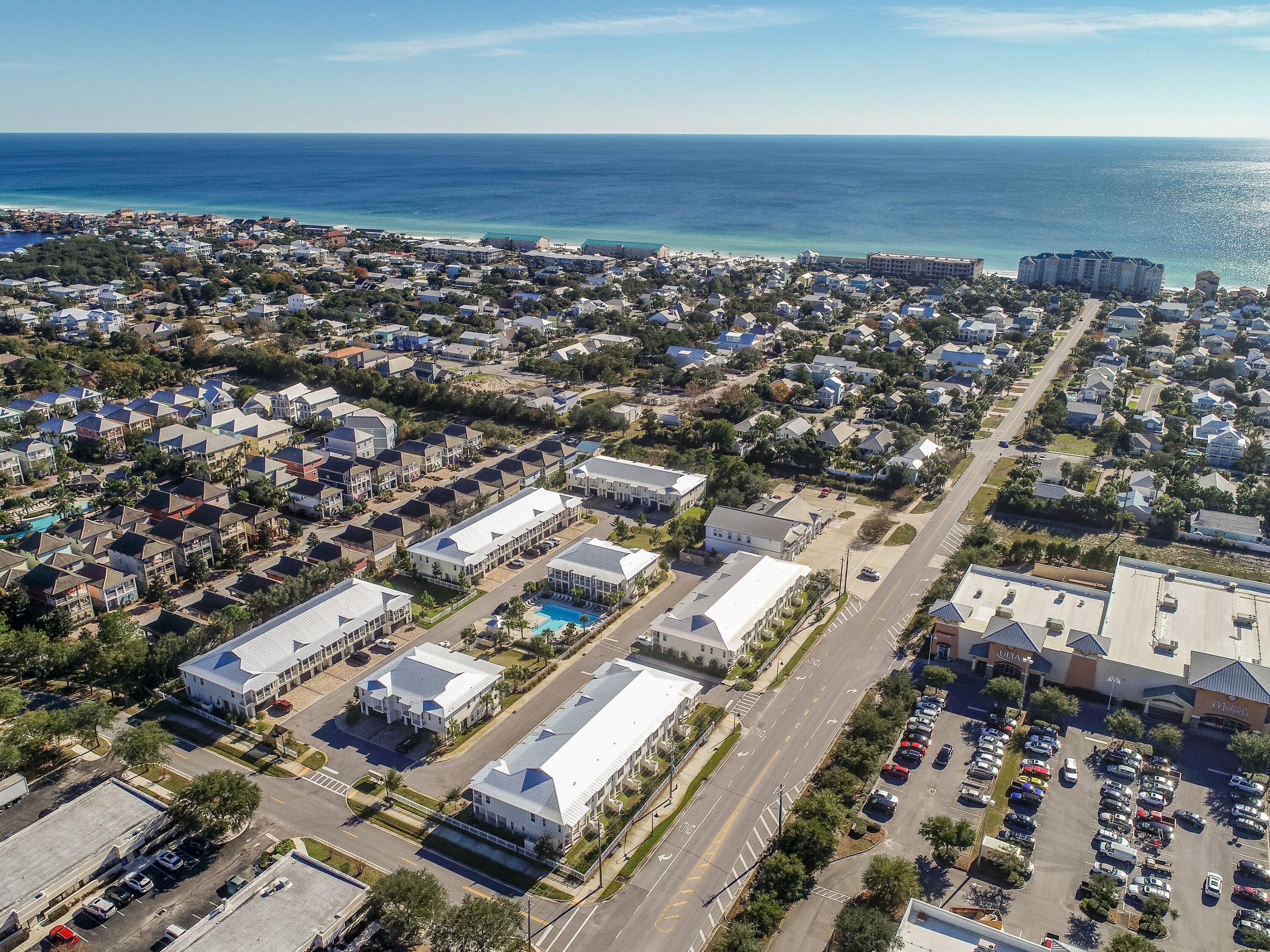 One Twenty Five Crystal Beach Drive is a resort-style townhome community located in the heart of Crystal Beach, a quaint seaside community in Destin, Florida. Ideally situated between Destin's beaches (3 blocks away) and the award-winning Destin Commons, One Twenty Five Crystal Beach Drive is convenient to numerous shops, restaurants, a movie theater, bowling alley and multiple public beach accesses. The beautiful pool is centrally located and the community is dog friendly with a dog park and golf cart friendly! This spacious townhome residence is one of the original owners and has never been rented. Located South of Emerald Coast Parkway, it is positioned to be a great short-term rental, second home or primary residence property. Upgraded premium lot location on the pool and is one of the few units with a fenced- in back yard! Interior features include, nine foot ceilings on both floors, white shaker style wood cabinetry, brushed nickel hardware, granite countertops, screens on each patio door, PEX piping, ceiling fans throughout, FULLY FURNISHED including the porch furniture, crown molding, laminate wood flooring, porcelain tile in bathrooms, stainless steel GE appliances, paver driveway, and is equipped with a fire suppressant system that will save on your insurance. Plenty of room for everyone with three bedrooms, two full bathrooms, 3 balconies, a powder room and is a spacious 1644 square feet. The private one-car garage offers security, a hose bib, and plenty of storage! Two more guest parking spaces in front of the garage! Exterior features Hardi-plank style siding, metal roofs, and impact resistant windows and doors and an open green space across the street. Low HOA fees include pool & dog park maintenance, all lawn maintenance, exterior painting, pest control and the roof reserves!
