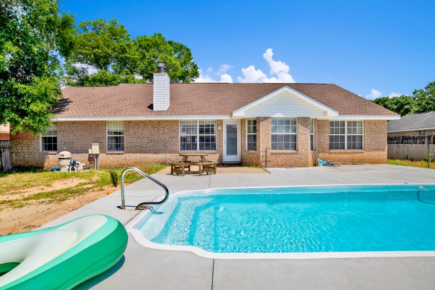 Welcome to your dream pool home! This 4 bedroom, 2 bathroom residence offers room for the whole family and is packed with features designed for comfort, functionality, and entertaining. Step inside to an inviting floor plan with luxury vinyl plank flooring in the main living areas and cozy carpet in the bedrooms. A versatile flex room provides endless possibilities--use it as a home office, playroom, or an additional living space to suit your needs.The heart of the home is the expansive living room featuring cathedral ceilings, charming plant ledges, and a cozy wood-burning fireplace. The updated kitchen is a chef's delight with butcher block countertops, stainless steel appliances--including a double oven--and a breakfast nook that overlooks the sparkling in-ground saltwater pool through bay windows. 
Host holiday meals or dinner parties in the elegant formal dining room, while the split bedroom layout ensures privacy. The spacious primary suite is a true retreat, boasting a beautifully updated ensuite bathroom complete with two walk-in closets, a garden tub, and a private water closet. Three additional bedrooms offer ample space, ceiling fans, and generous closet storage.

A large laundry room provides direct access to the double car garage, adding to the home's everyday convenience. Step outside to your fully fenced backyard oasisperfect for outdoor entertaining, complete with a refreshing saltwater pool to cool off on hot summer days.

Don't miss your chance to own this thoughtfully designed home that combines comfort, charm, and functionality in one perfect package!