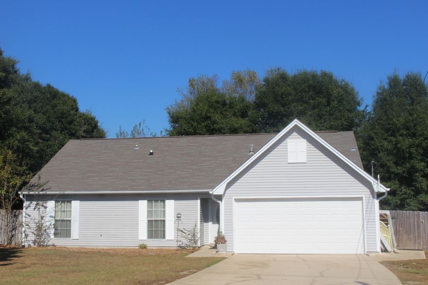 MOVE-IN READY 5 bd/3 ba home located in south Crestview...superb location to I-10 and military bases. The interior has been freshly painted and features a large kitchen with white cabinetry, center island and pantry. Living room has very high ceilings, fireplace and upstairs loft overlooking this area. 3 bd/2 ba and all tile flooring on the main level; 2 bd/1 ba with bonus loft area on the second floor. Plenty of room for the entire family! Large, interior laundry room with folding counter. New roof in 2004; Termite bond in place through Bryan Pest Control. The home is situated on a large, level lot (approx .40 acre) with screened-in porch and privacy fenced-in backyard. Enjoy your coffee from your back porch! Irrigation system to convey in ''as is'' condition.