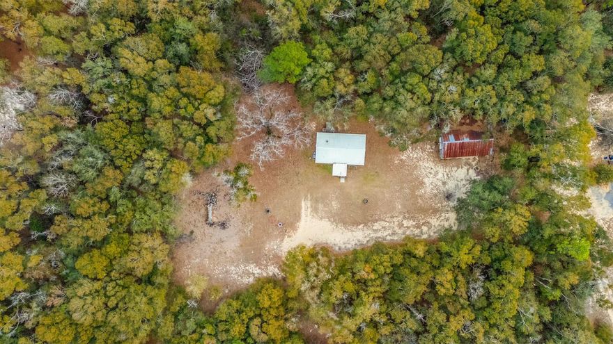 Looking for a country getaway? This 3bd/2ba home on approx. +/- 2 acres could be the one. Large workshop with electric on the property as well. Home underwent major renovations in 2022. New HVAC, plumbing, water heater, and septic installed 2022. Metal roof is approx. 2020. Has mature tree border, located off of paved road. Plenty of space for recreation, animals or gardening.
