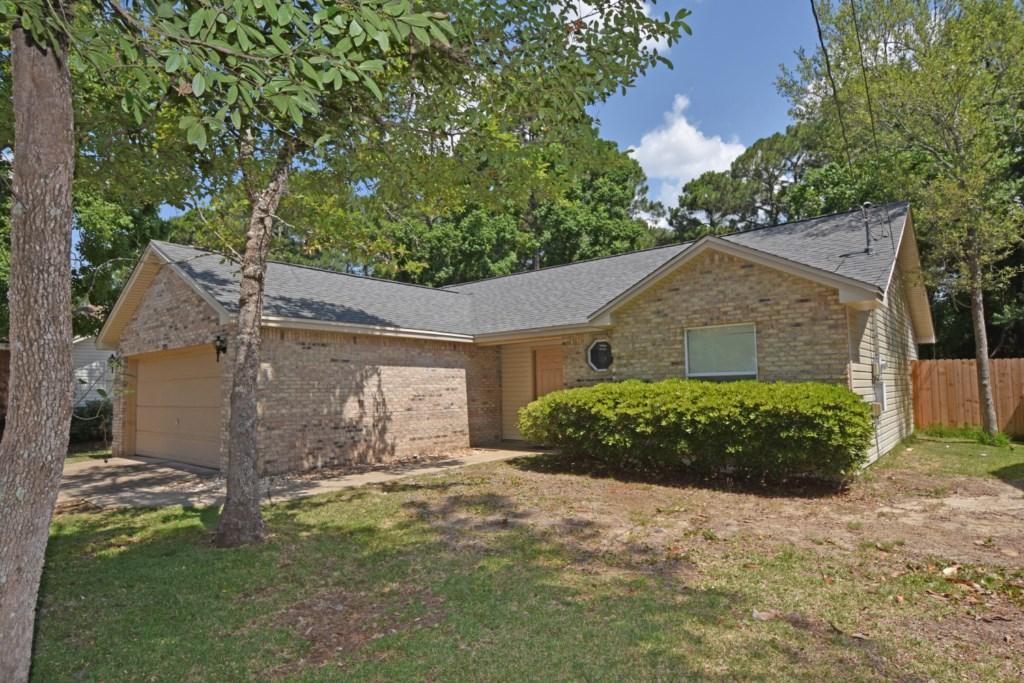 Great LOCATION in Niceville! The Seller is offering to pay Most CLOSING COSTS and a 1YR Home Warranty! Convenient to Eglin AFB, shopping, dining, Niceville children's park, and beaches! Split Bedroom home with STAINED CONCRETE Floors and Wood Laminate Flooring! NEW Roof Dec.2013 and NEW Privacy Fence this year! Enjoy the open concept floor plan with a cathedral ceiling and plant ledge in the Living Room. Stained concrete floors in the Kitchen, Laundry Room, Master Suite, and 2nd Full Bath. Wood laminate flooring in the Living and Dining Room. Tiled entry in the Foyer. Carpet is in the addition 2nd and 3rd bedrooms. Access the OVERSIZED 23x10 open patio in the back yard from the Dining Area or the Master Bedroom. Large back yard is shaded with mature trees.Schedule your showing today