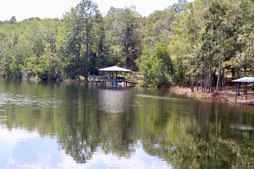 Cultivate your dreams on 80 acres of prime North Walton County land, just 40 minutes from the beautiful beaches of 30A. This country estate boasts a stocked 10-acre pond fed by 2 springs, a renovated 2 bed/1 bath home, a large metal shop, and ample space for equestrian activities. Enjoy hunting, fishing, and outdoor adventures year-round.  This property offers excellent investment potential and is perfect for equestrian enthusiasts. *Buyer to verify all information, measurements and dimensions.'