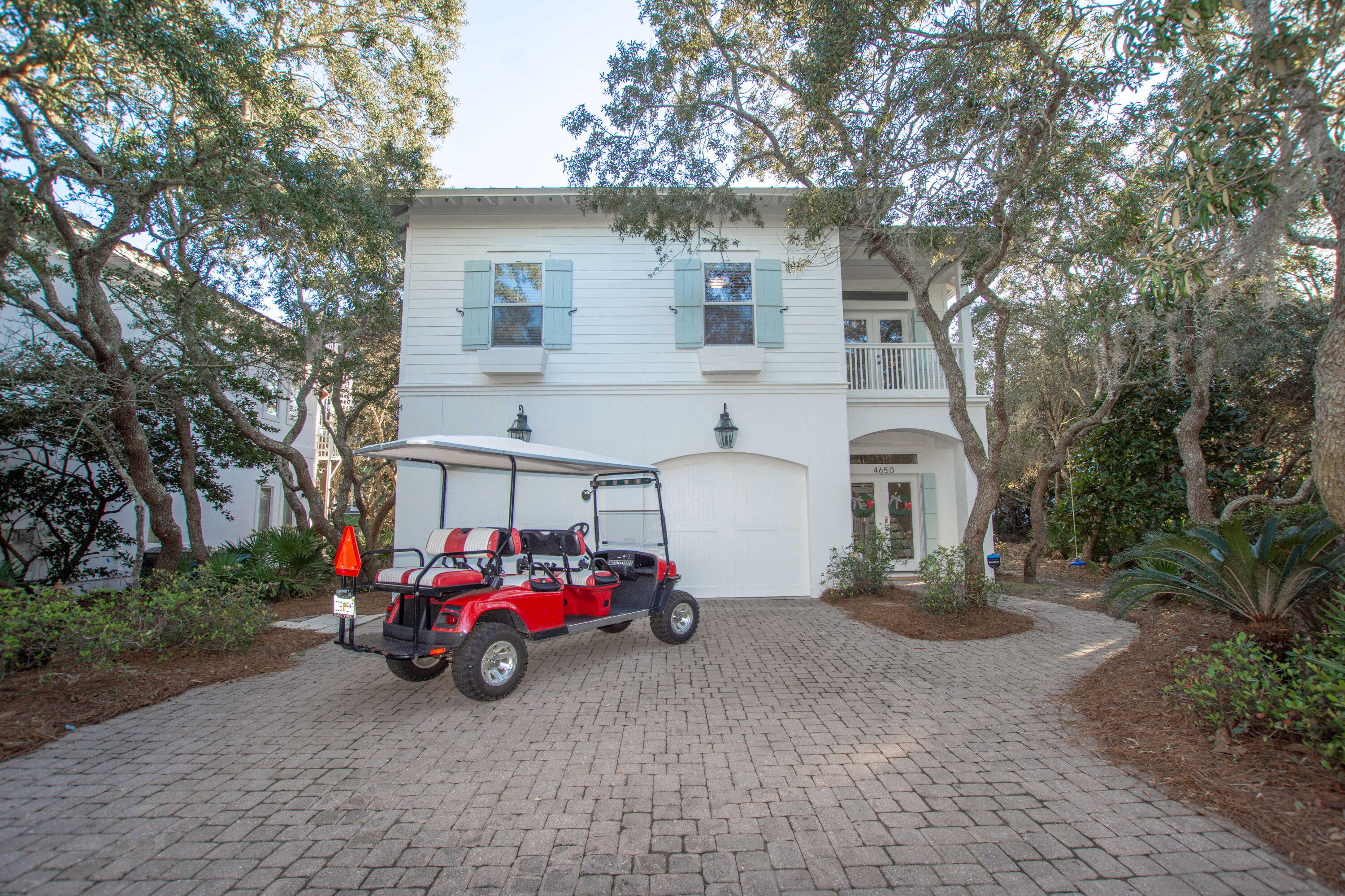 Nestled in one of the most lush and private locations along Scenic 98 in Destin, this upscale Gulf peek view beach house PLUS 6-seater golf cart is just a quick jaunt to the beach access and has room for a splash pool! With 5 bedrooms, this home can easily sleep 17+ guests in comfort! This beautiful home exudes Florida elegance, communicated through beautiful interiors and finishes, superb craftsmanship and wonderful amenities. Inviting, light-filled rooms welcome you, while the home's coastal chic ambiance suggests casually elegant living and entertaining in all seasons. The beach house has a metal roof and has just been freshly painted with Resilience Moisture Guard paint so there should be no maintenance worries for years to come, and is surrounded by scrub oaks dripping in moss!