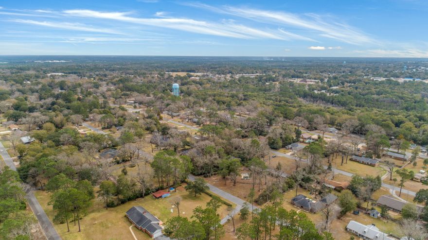Build up to 7 homes on this centrally located, partially cleared property in the established Adams Powell Subdivision of Crestview. Just minutes from shopping, but with plenty of space surrounding. Existing structure on some of the property, which may be salvaged or cleared for development. Property being sold AS IS with no disclosures. Great property for developers looking to build!