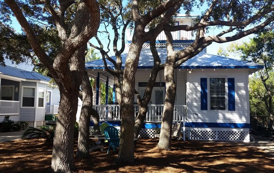 Kokomo Kove Is Close To Gulf With Private Beach Access. Front Porch Overlooks Yard With Native Twisted Oaks. Enter Into Living Area With High Ceilings Of Pine Planks. LR With Fireplace, Multiple Doors To Porches, & Lots Of Natural Light. Beautiful Kitchen With Chalk Board Counters, New Bosch Stainless Appliances, & Plenty Of Cabinet Space. BR #1 Is Up Front, Nice Sized With Ample Closet Space. Next To Kitchen Is Laundry And Extra Storage. BR #2 Has Private Entry To 2nd Full Bathroom. Nice Sized MBR With Master Bath. Both These BR's & Baths Have Tile Flooring & Overlook Large Back Yard & Pool. Up The Spiral Stairway Is The Tower Room With Bunk Beds, Table, & Stools. From Balcony There Is A Peek Of The Gulf. Great Back Yard With Pool & Seating Areas. Seller Is Motivated So Take A Good Look!