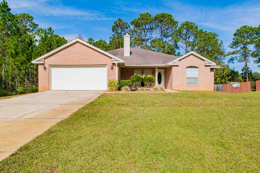 This home is located in Holley By The Sea and has 4 bedrooms and 2 bathrooms. You'll enjoy the open, spacious living area with vaulted ceilings and open concept living. The kitchen has a large island and a pantry. Across the way, you'll find a spacious dining area that flows into the living room with a wood burning fireplace. The master suite located just off the kitchen, has a double vanity in the bathroom and is located on the opposite side of the house from the additional 3 bedrooms allowing for privacy. Other notables are fully fenced back yard, 2 car garage, laundry room inside. 17 miles to Hurlburt and 7 miles to Navarre Beach! Enjoy all the amenities Holley By The Sea has to offer such as a pool, community gym, community center, tennis and more! Check out our full video tour on the