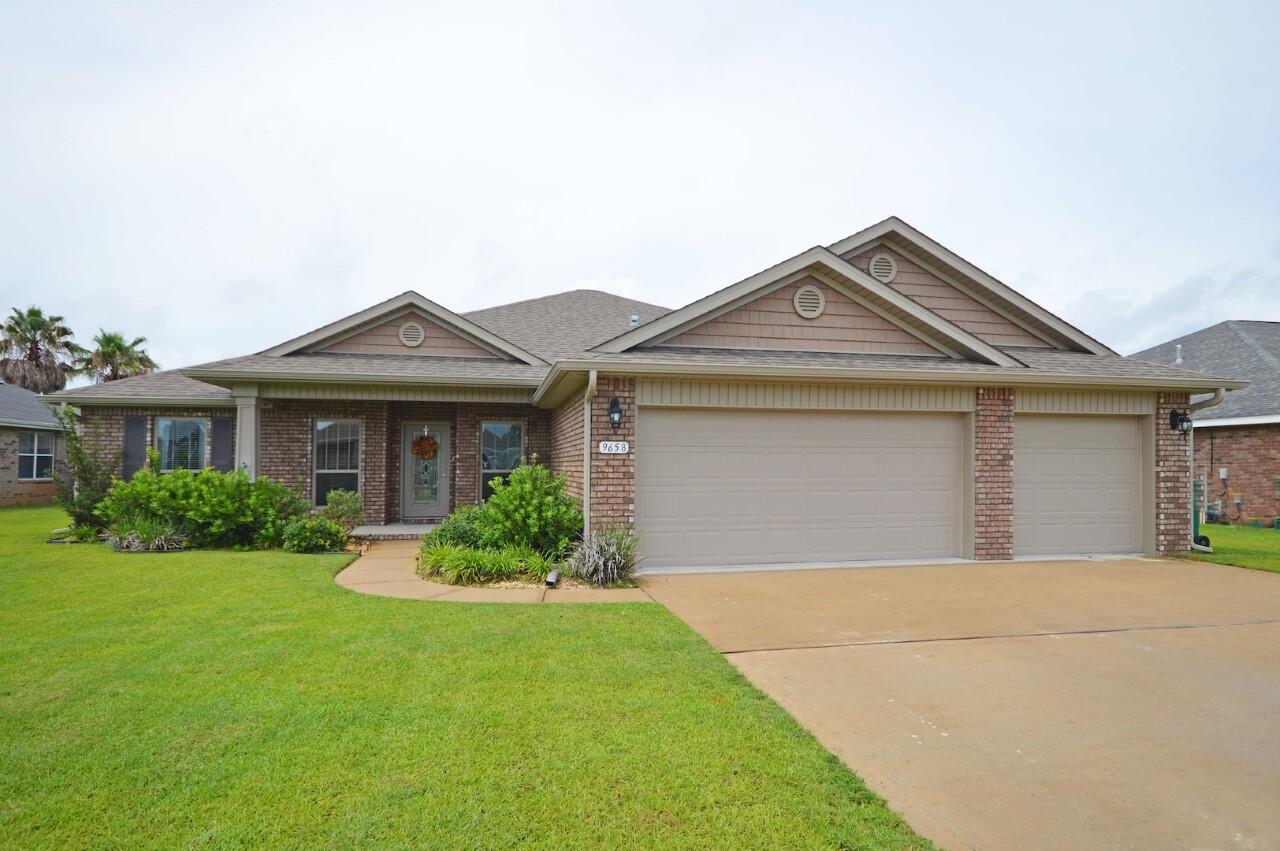 Exceptional all brick construction, 2370 sq. ft. 4 bedroom, 2.5 baths contemporary with open and split floor plan. Interior features: The kitchen opens to the great room with large center Island with sink, granite counter-tops, stainless steel appliances, tile floors, large pantry, upgraded carpeted throughout except for wet areas, baths have upgraded fixtures, designer faucets, formal dining room and large eat-in dining area. The master suite has boxed ceiling, double vanity, cultured marble vanity, designer faucets, private water closet, Garden Style tub and tile shower built Handicap accessible, and 2 large walk-in closet. One Bedroom used for an office. All windows have 2'' faux wood blinds which convey with the property, curtains do not.