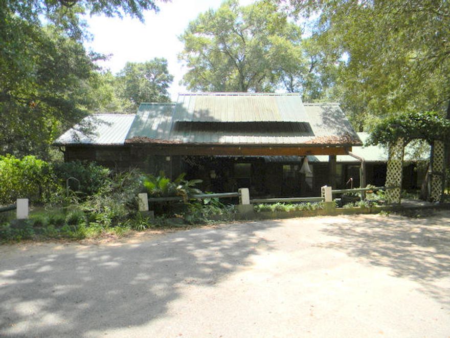 This listing is for two lots and 2 homes. If you love outdoor living along with the comforts of a home on a peaceful lake, then look no further! The first lot has a 3 bedroom 2 bath home on just shy of 2.5 acres with a dock on the lake. Master bedroom and bath were added in 2010. Master opens to a large screened porch overlooking the lake. This home is built for outdoor (covered) entertaining! Don't miss the great bar perfect for those game days! There is a 4 car carport and a covered storage area. The 2nd home is a mobile home on 1.020 acres and a great water front getaway or this would be a great rental property next door to help cover expenses. This could make for a great investment to call home, own as a weekend retreat for fishing and hunting or to clean up and resell. Priced to sell