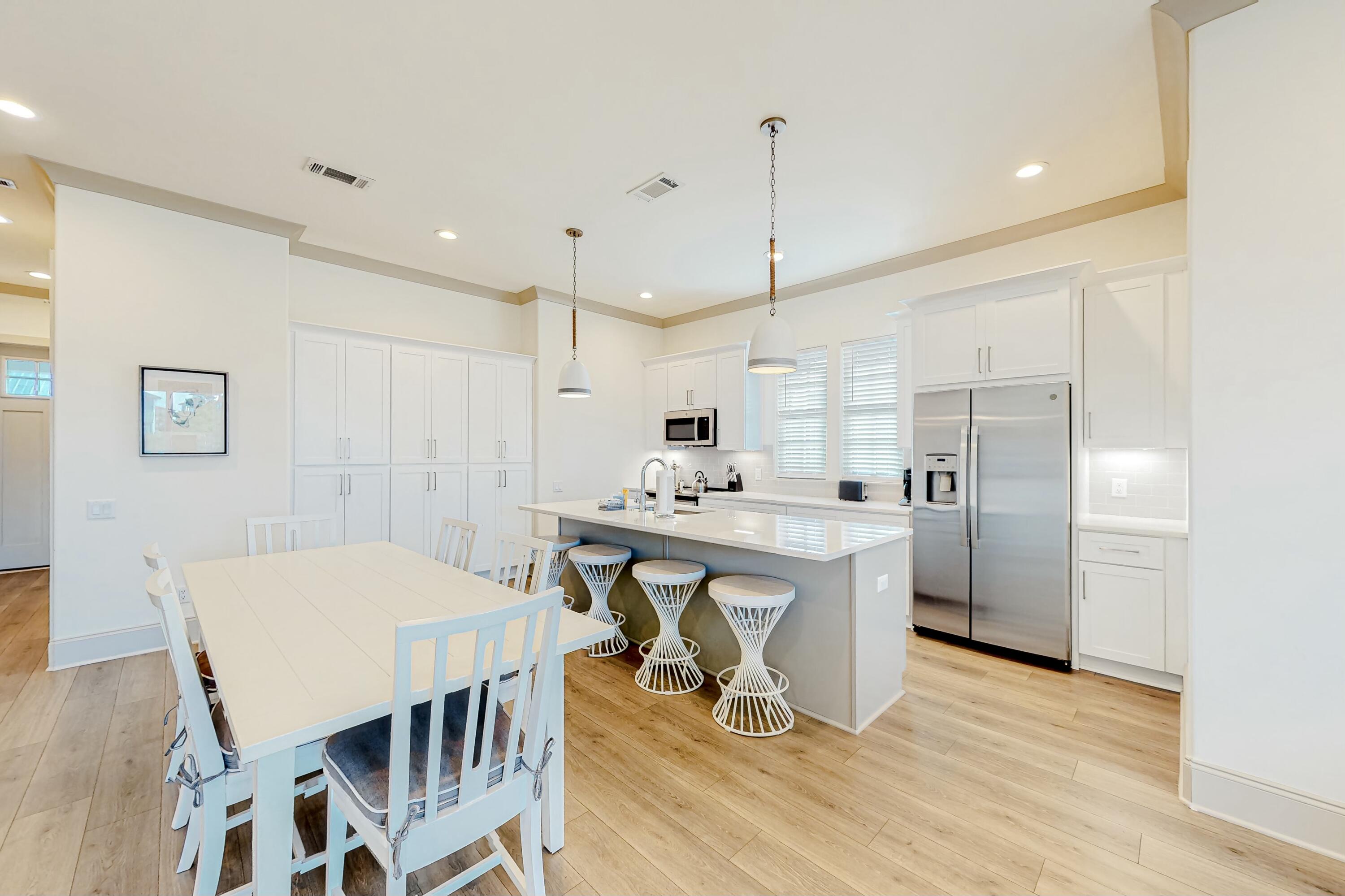 Experience refined coastal living in this top-floor end unit at Azure of 30A. With a spacious layout, tall ceilings, and extra windows, this residence is filled with natural light. Thoughtfully designed with high-end finishes, solid shaker doors and cabinetry, quartz countertops, and custom bunk beds, it offers both style and comfort. The private balcony provides an ideal setting to unwind, with elevated views and refreshing coastal breezes. This quiet, exclusive community features a heated resort-style pool and spa and is just steps from two convenient beach accesses. With close proximity to local activities and the beach, this 19-residence development is an excellent choice for a second home or vacation rental.
