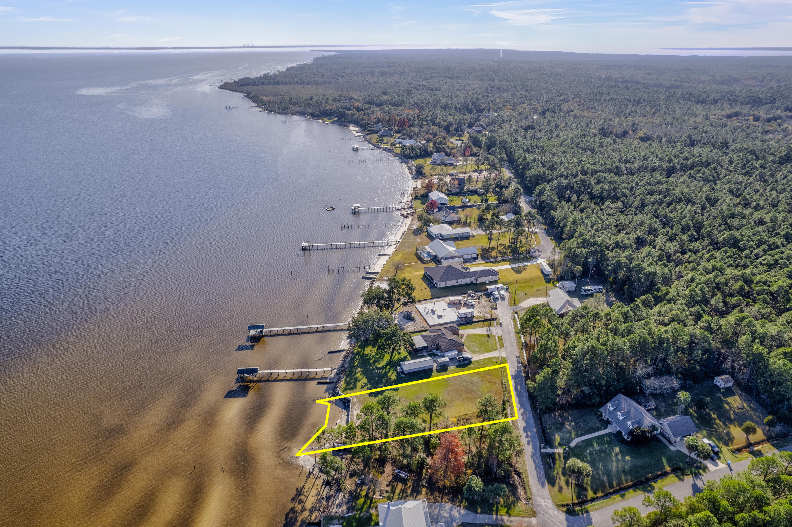 Beautiful Blackwater Bay waterfront lot with access to Pensacola Bay & Gulf of Mexico! Well maintained level lot located in a quiet neighborhood with no through traffic close to Interstate 10, Milton, Gulf Breeze and Garcon Point Bridge. Wooded area to left of lot cannot be built on per seller. Must see and walk the lot to appreciate the beauty & value! All information to be verified by buyer.