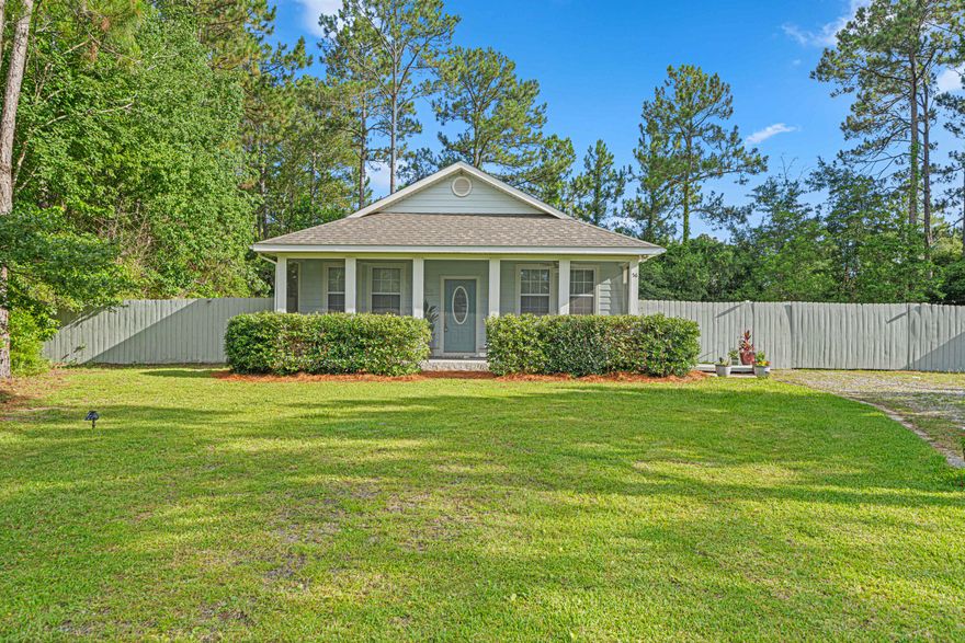Welcome to your sweet slice of serenity in Freeport, Florida--a small-town gem that's booming with growth and opportunity! This adorable Craftsman-style cottage is tucked away at the end of a quiet cul-de-sac on a generous half-acre lot, with no HOA in sight (that's right--NO HOA!).This home is truly turn-key, with repairs already done and a long list of upgrades that will win you over: new luxury vinyl plank flooring, new roof, new Trane AC, updated fixtures, fresh paint throughout, and even a whole-house security system to give you peace of mind.Step inside and enjoy a smartly designed 3 bedroom, 2 bath layout with a bright, efficient kitchen and cozy, welcoming spaces throughout. Morning coffee feels better on the screened-in front porch, and evenings are magical on the large, newly screened-in back porch, overlooking your private fenced backyard.

In addition, the deck with built-in bench seating is made for BBQs, bonfires, or lazy nights under the twinkling caf?? lights. Need extra storage? You've got a detached storage building out back ready for your tools, toys, or hobbies.

All this quiet country charm is located just minutes from shops and restaurants, and only 15 minutes from the white-sand beaches and emerald waters of the Emerald Coast.

In one of Florida's fastest-growing cities, this charming, updated cottage is ready for you to move in and start living the good life!

