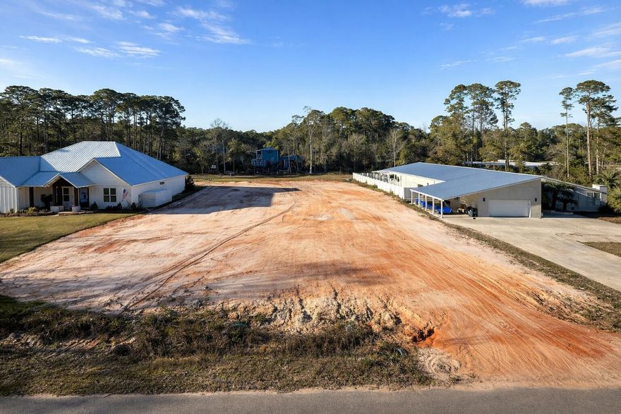 Build-ready 0.50-acre residential lot located in the established Lagrange Shores community on Magnolia Drive in Freeport. The lot has been cleared, filled, and prepped, providing a significant head start on construction. Survey on file. This is a large lot with beautiful and well-maintained surrounding homes, offering a true neighborhood setting. Lot C-24 offers a convenient location in booming Freeport, providing easy access to schools, shopping, and South Walton beaches. This one is ready for a custom home or investment build!