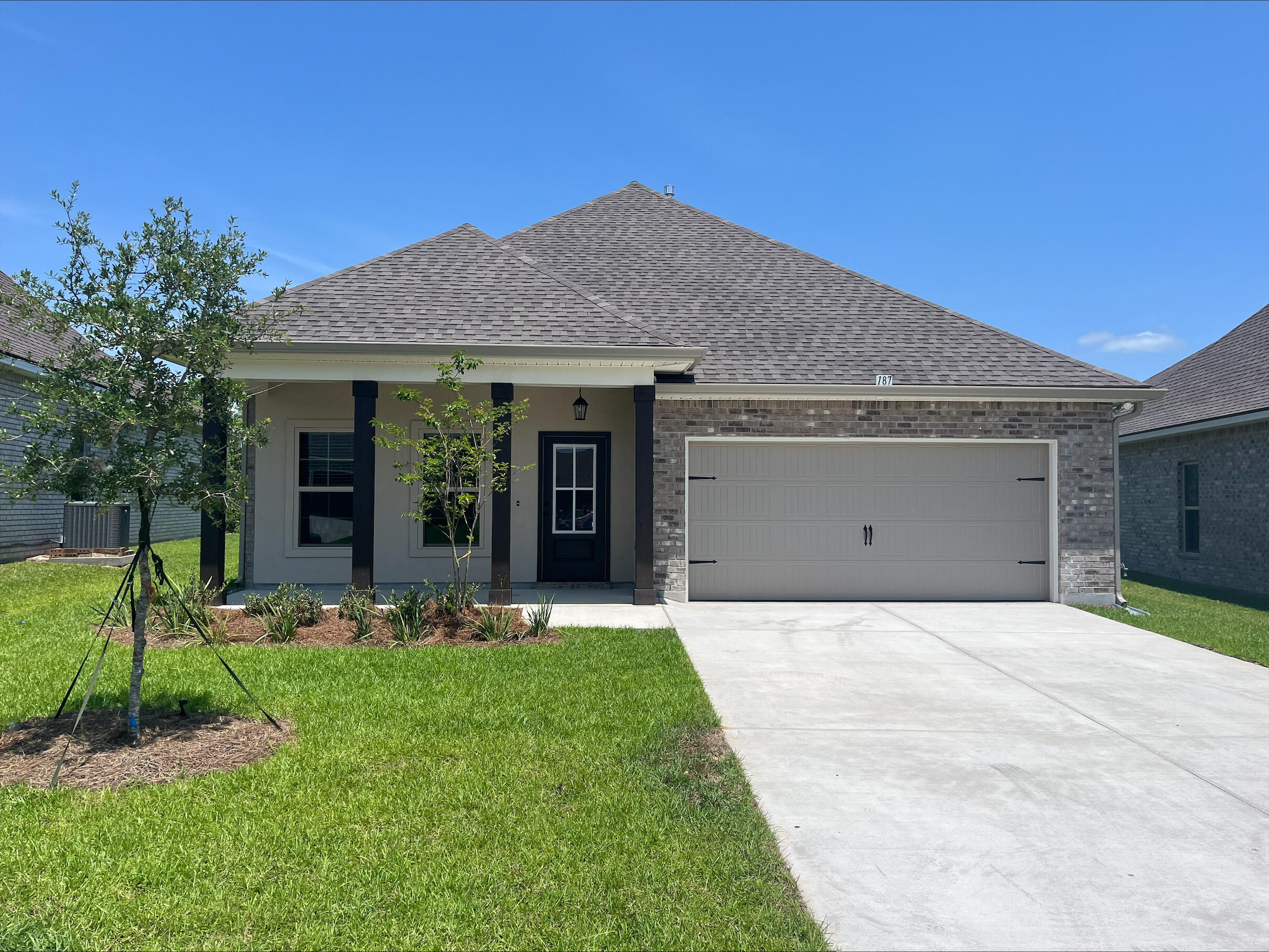 Awesome builder rate plus FREE front gutters. Restrictions apply.The OAKSTONE V B in The Bluffs at Lafayette community offers a 4BR, 2BA open design. Upgrades added (list attached).Special Features: double vanity, garden tub, separate shower, and walk-in closet in master bath, kitchen island, walk-in pantry, covered front porch and rear patio, undermount sinks, crown molding, ceiling fan in living and master, framed mirrors in baths, smoke and carbon monoxide detectors, landscaping, architectural 30-year shingles, flood lights, and more!Energy Efficient Features: tankless gas water heater, kitchen appliance package with electric range, vinyl low E windows, and more! Energy Star Partner.