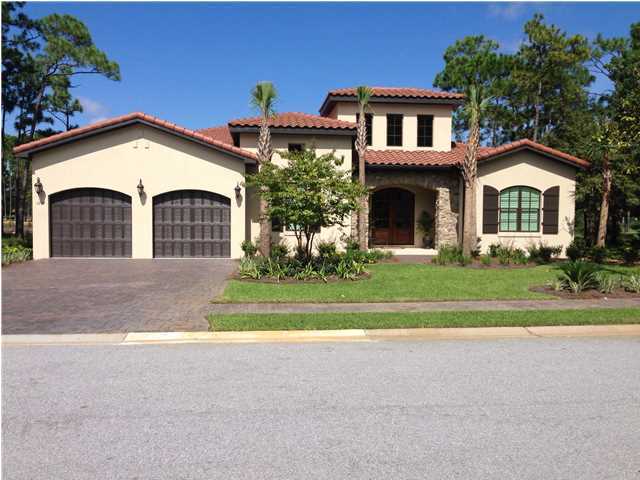 This lakefront Huff home is to be built in Genoa at Sandestin Golf and Beach Resort. Sandestin is ideally located near Silver Sands Premium Outlets and Destin, but also convenient to Scenic Highway 30A. Grand Boulevard is nearby, featuring the new Boulevard Cinema 10 movie theater, a Public grocery store, as well as upscale shopping and fine dining. The home shown reflects a comparable home in Genoa to that which is to be built. This single-story home features an open floor plan whose living and dining rooms open onto a screened back porch overlooking the lake at Genoa. A two-car garage with automatic door opener offers enough room to park a golf cart.