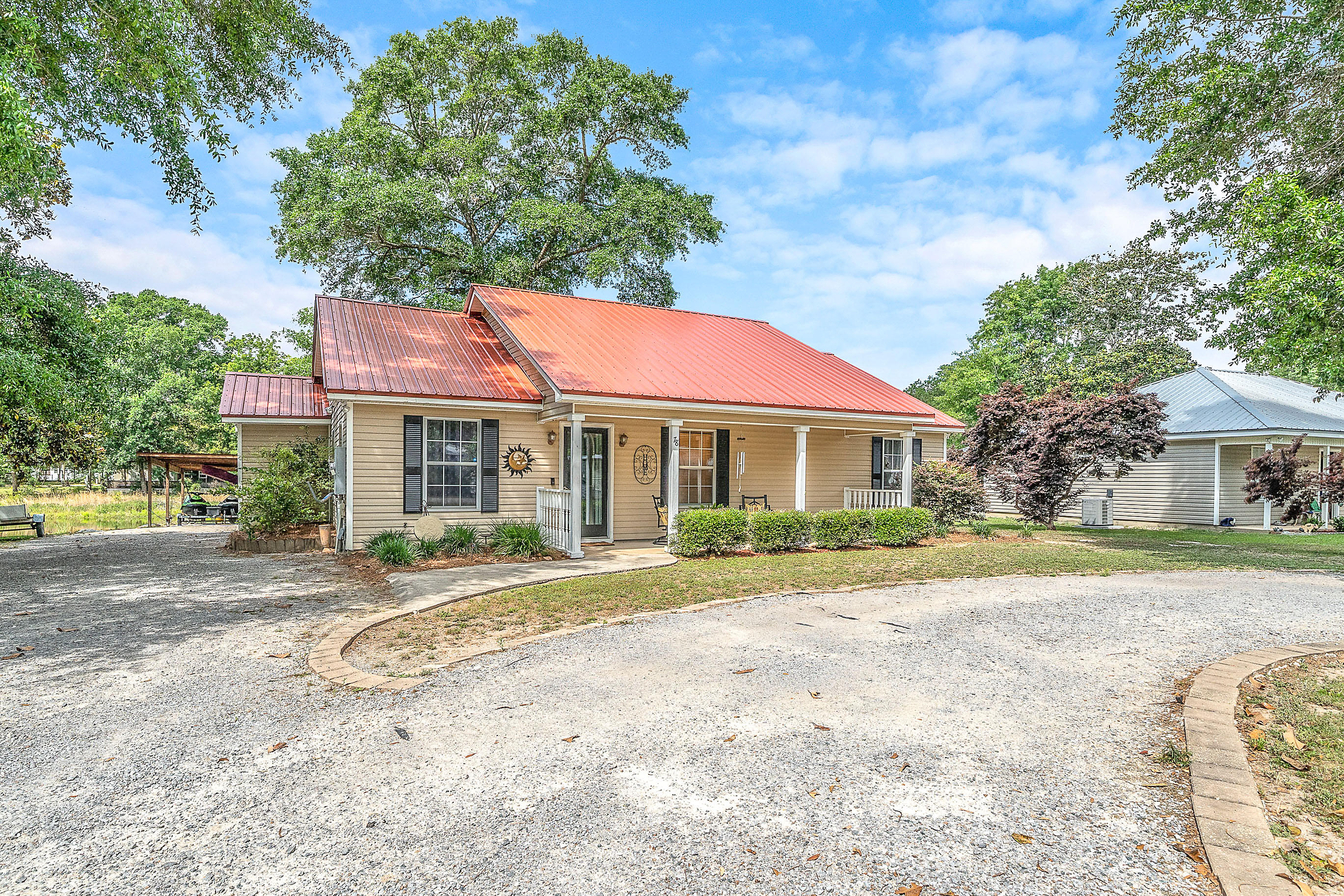 3 bedroom, 2 bath home is move-in ready! Over $12,000 in updates, New Metal Roof, New Tile Flooring, A must see and will not last long! If fun in the sun is what you need, then come see this well maintained home in the tranquil setting of Magnolia Baye subdivision. Fish from your own pier in the back yard! Black Creek Lodge Marina boat launch is only one mile away, and only 12 miles to the white sandy beaches at Grayton Beach State Park! This is a beautifully maintained home, you will not be disappointed.