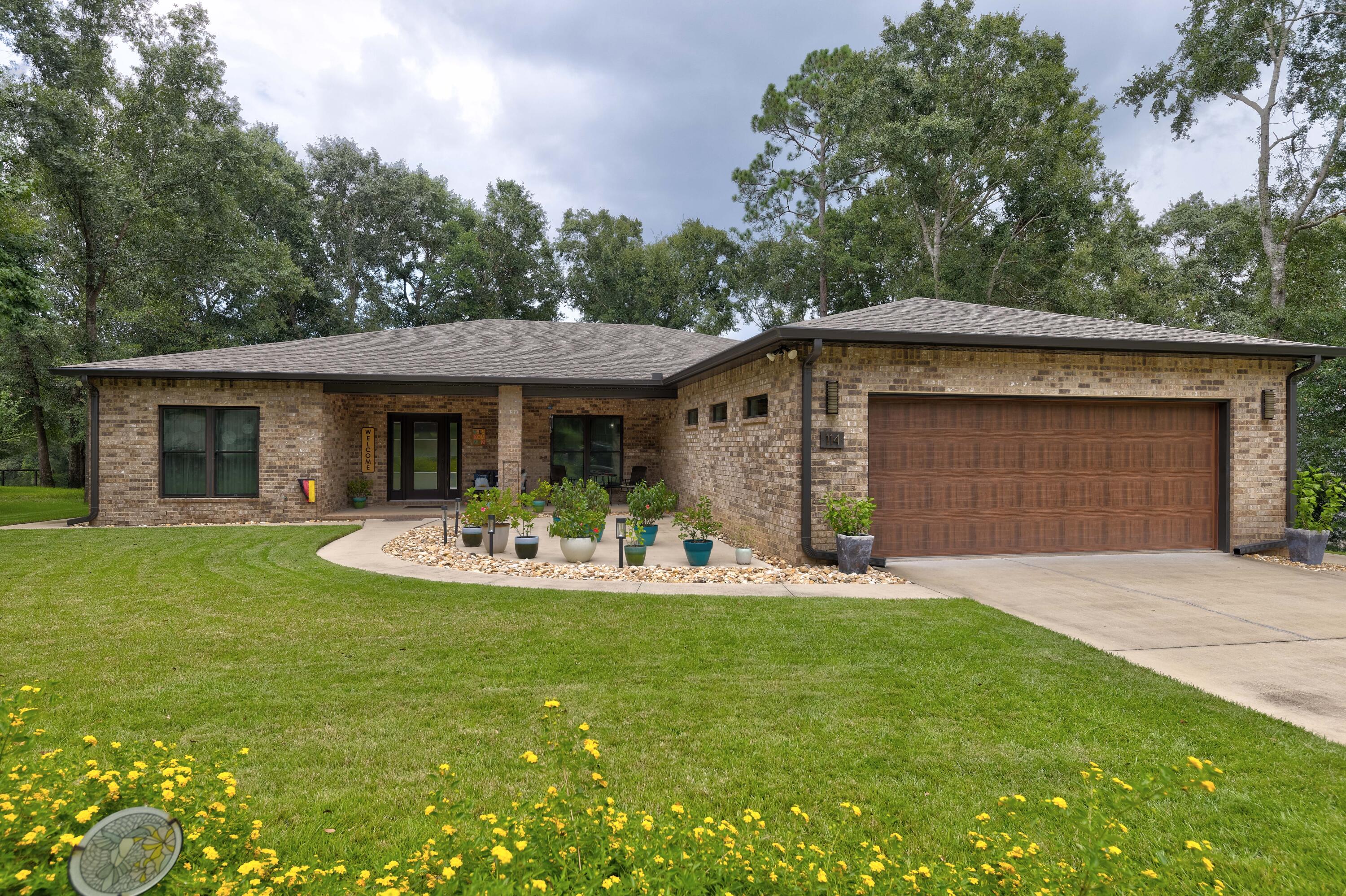 Welcome Home! If clean lines and upgrades are on your wishlist, this could be the one for you. This home is being sold by its original owners, who built it just a few years ago in 2017. During construction, no detail was left unattended. There is no carpet here, the flooring in the main living area was recently upgraded to LVP, and all other areas of the home are laminate or tile. Other upgrades include a whole home Generac generator, a 250-gallon in-ground propane tank, a tankless Rennai water heater, hurricane-rated Pella doors, as well as premium outlet and switch covers. When walking through the front door, prepare to be greeted by nice chunky baseboards, an open split floorplan, and lots of natural light. Currently, the home is set up as a three-bedroom with a bonus room.