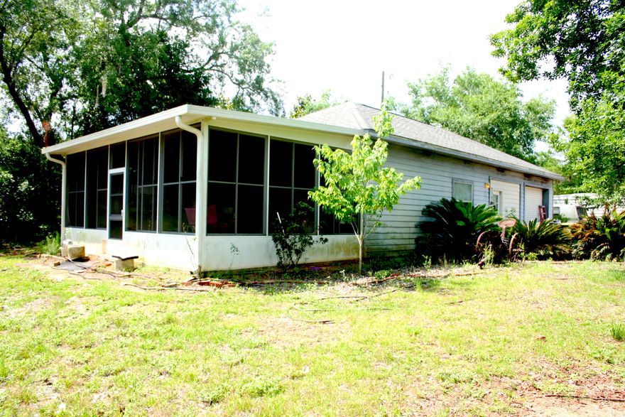 BEAUTIFUL 1.835 ACRES ON EAST BAY WITH A 190 FT. DOCK, SEAWALL, AND RIP-RAP.Across the street from Hidden Creek Golf Course, minutes from the emerald green waters and white sand of Navarre Beach. One bedroom home on the property was built as a working home for the main house to be built overlooking the Bay. Build your dream home and enjoy boating, swimming, fishing, and beautiful Florida sunsets!