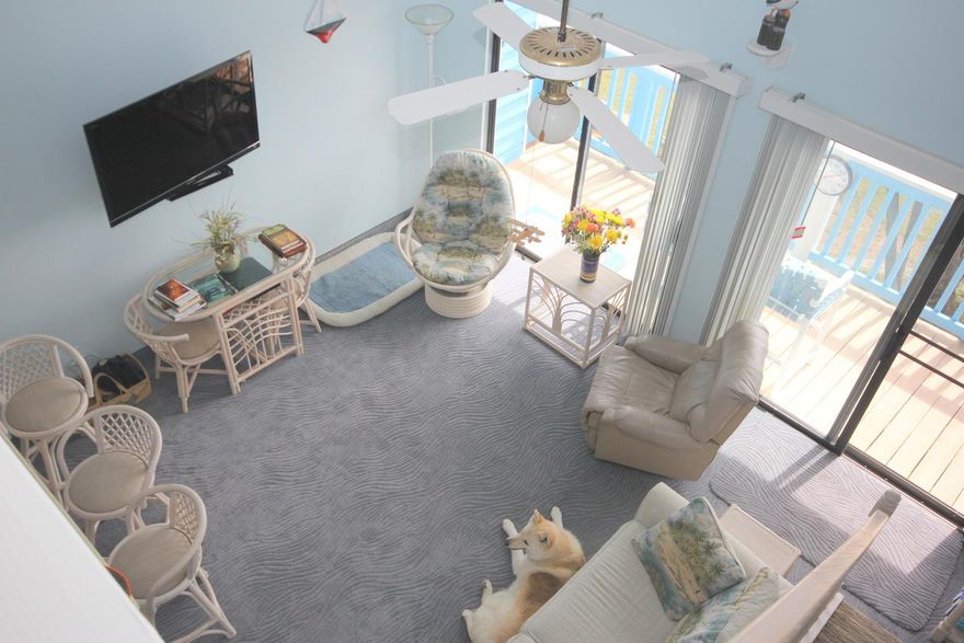 Just Listed!!! This Beachfront II Loft Bedroom Condo is a 2 minute walk to the beautiful blue green Gulf Waters. The cathedral ceiling gives it a bright and open feel with great views of the Gulf and lake while overlooking the pool. The current owners have impeccably maintained and upgraded this condo. It has never been on a rental program. Beachfront II offers, along with the pool, outdoor grills, a tiki hut area, covered parking, and an elevator. The back balconies were recently renovated and the building is newly painted. Offered furnished and rental ready with the exception of the rocker/recliner and custom carvings created by the seller. The vacant parcel, looking towards the Gulf is owned by the condo owners association and is part of the common area.