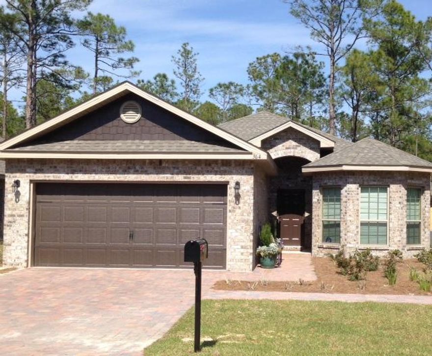 4 BEDROOMS PLUS A COVERED PATIO IN SOUTH WALTON COUNTY. ''Sleeping Beauty'' never had it this good! A single story home on one of the largest lots in the community and it back ups to a nature preserve. The master bedroom suite features a tray ceiling with en suite master bath that has double granite vanities, separate tiled shower, garden tub and water closet. Plus, a big walk in closet. The home also has a nice covered patio, 2 car garage, separate laundry room with cabinets, large family room with a breakfast area off of the kitchen, stainless steel appliances and an eat-in bar. If you need an affordable 4 bedroom home then this is it! This 4 sided brick home is located close to schools, parks, dining, shopping, beaches and no flood insurance required (Zone X)! Wood flooring is in the